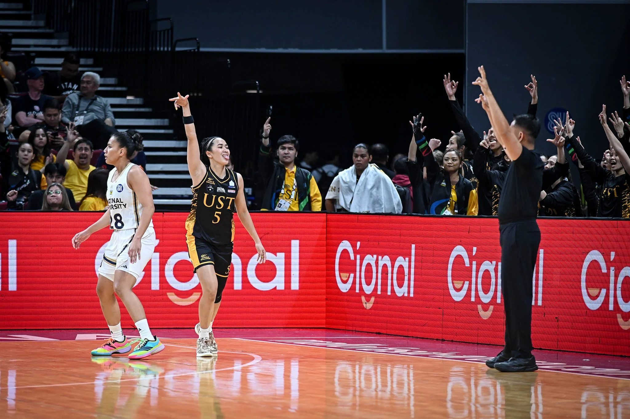 UST DOMINATES NU, ONE AWAY FROM FINALS