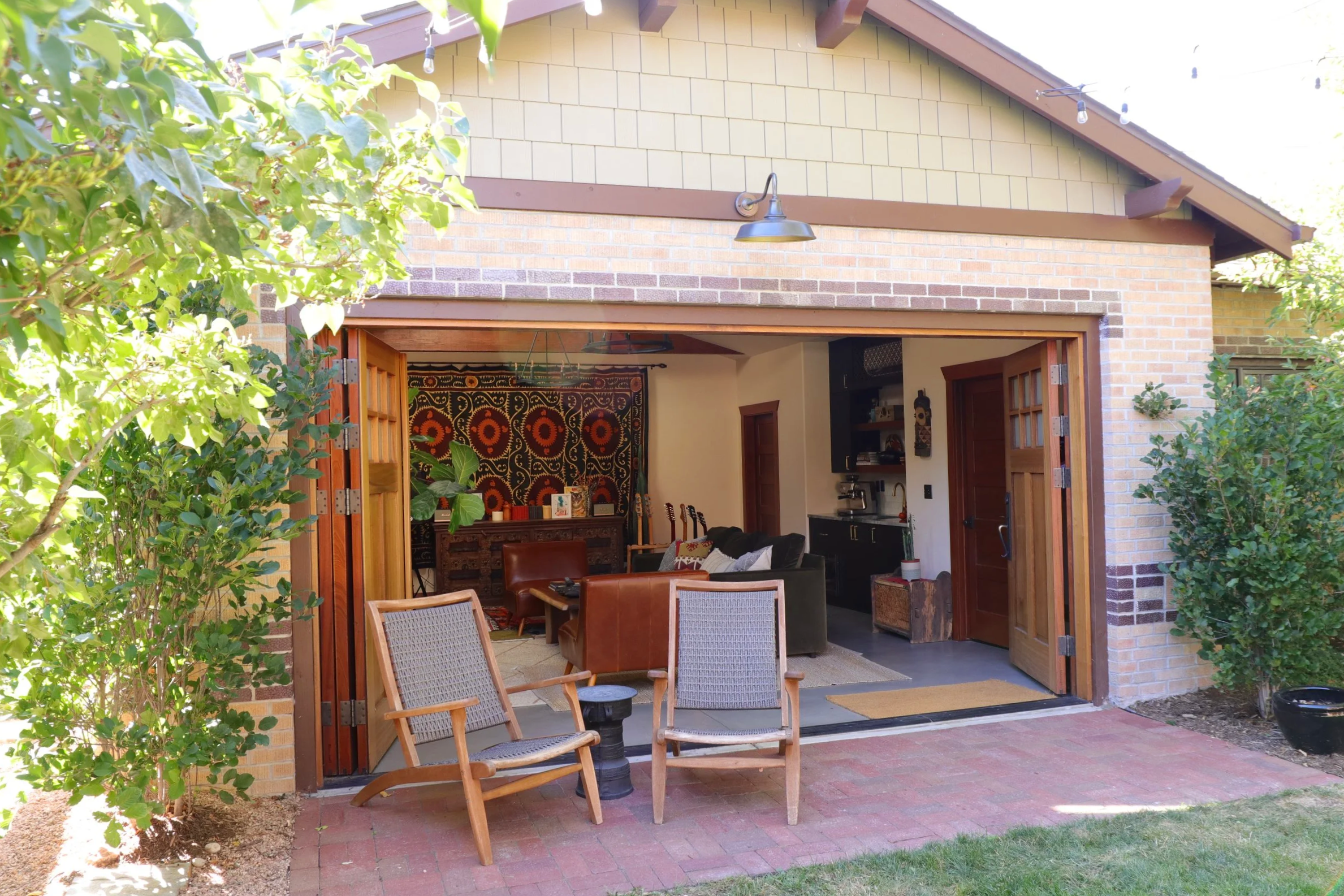 Modern kitchenette with dark cabinets, brass hardware and zellige-inspired tile, Denver ADU