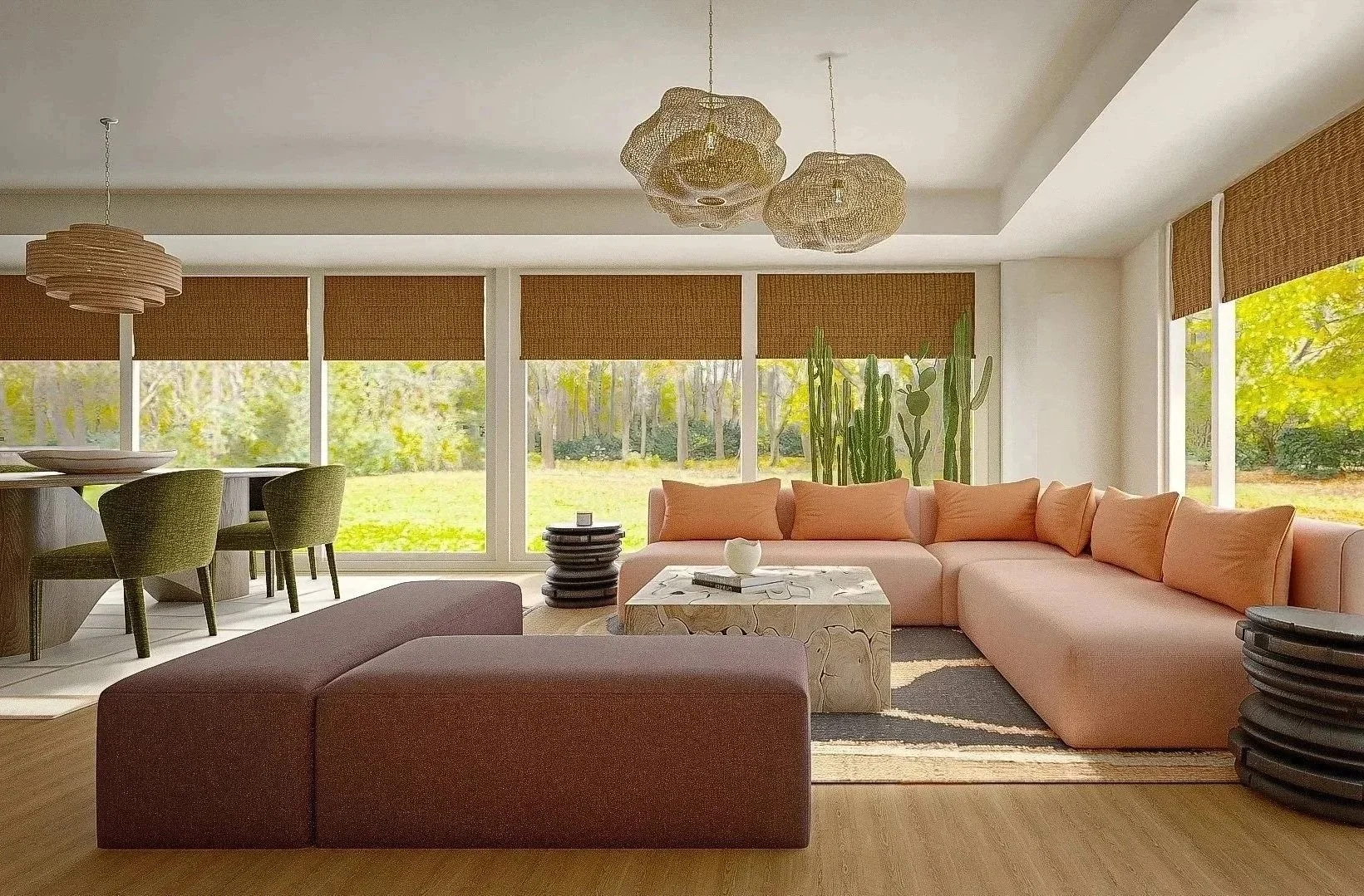 Living room with large windows, tan sectional sofa with orange cushions, marble coffee table, green chairs around a dining table, plush rug, and decorative pendant lights, with greenery visible outside.