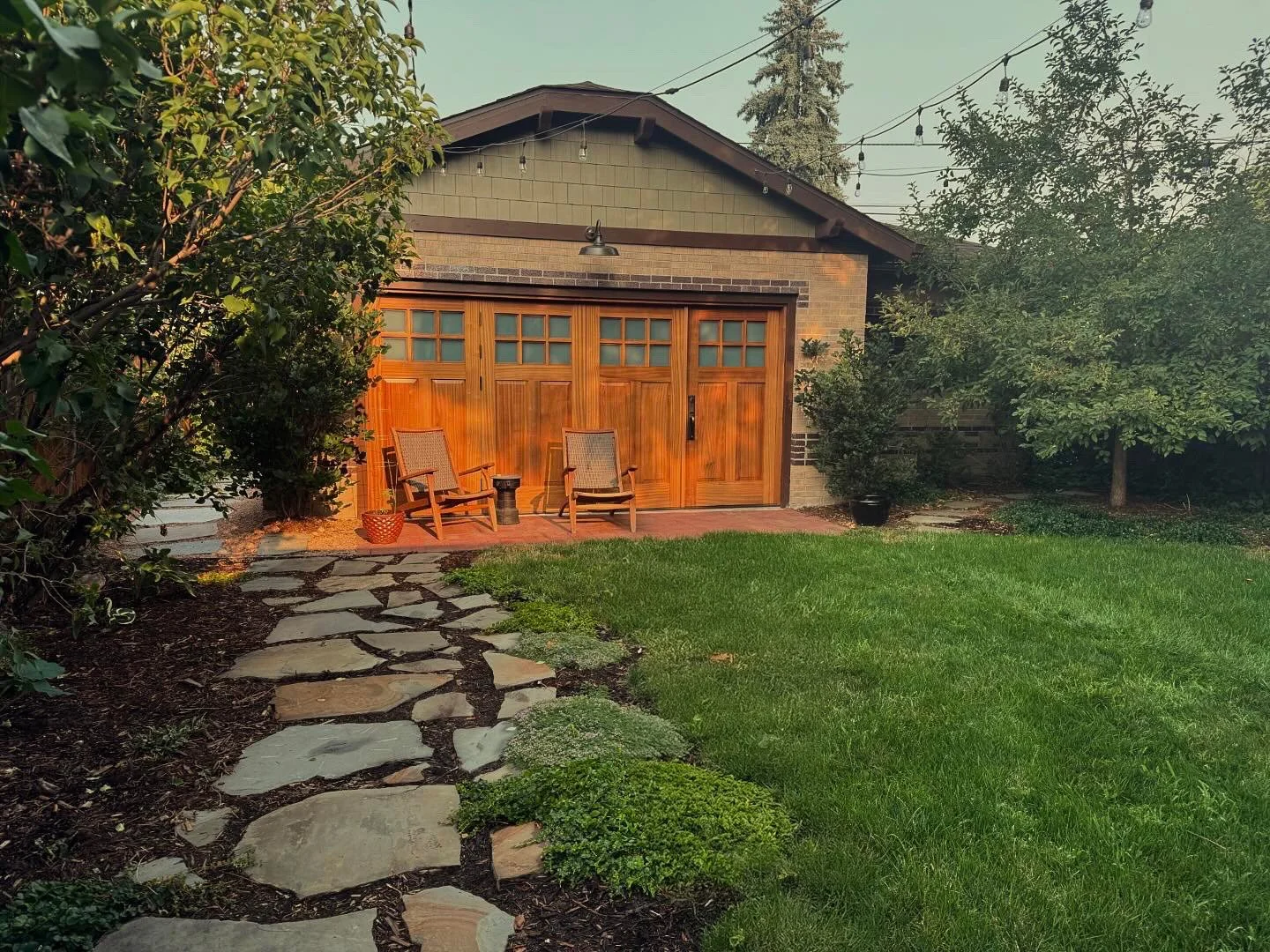 ADU kitchenette with open shelving, espresso machine and curated dishware