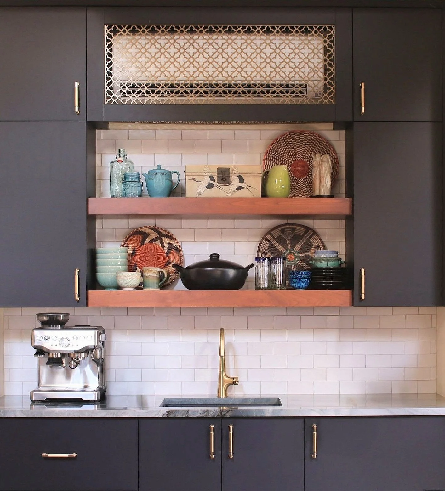 ADU kitchenette with open shelving, espresso machine and curated dishware