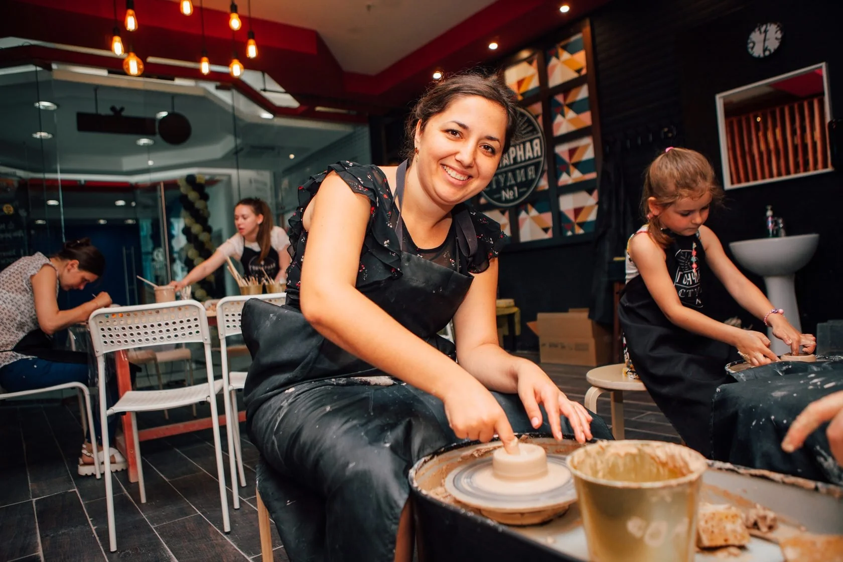 Pottery classes Deep Ellum group activity with step-by-step guidance
    