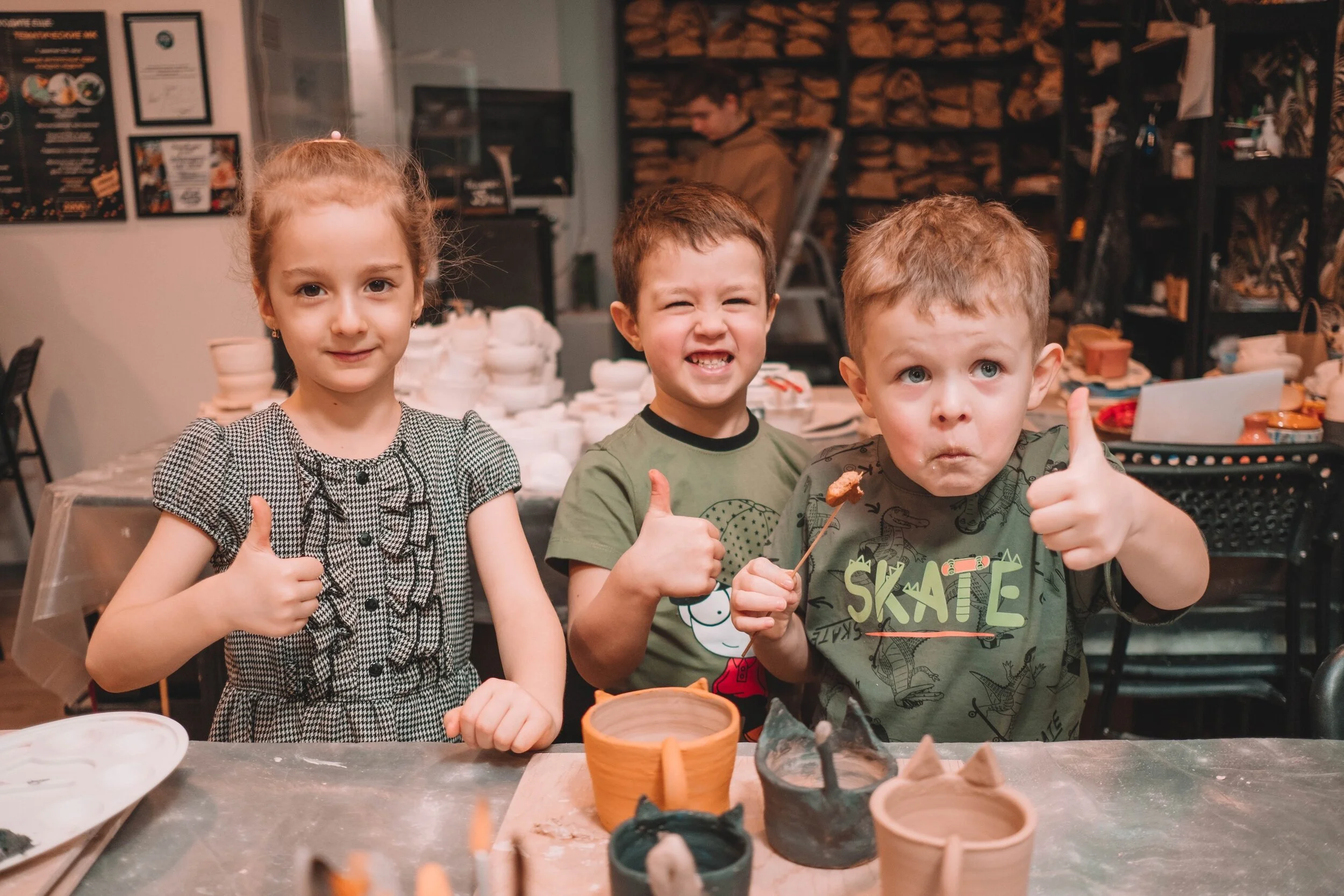 Pottery studio in Greenland Hills  with students working on clay  