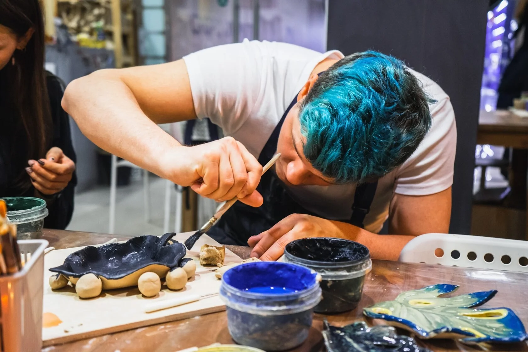 Pottery classes Junius Heights adults painting ceramic creations  