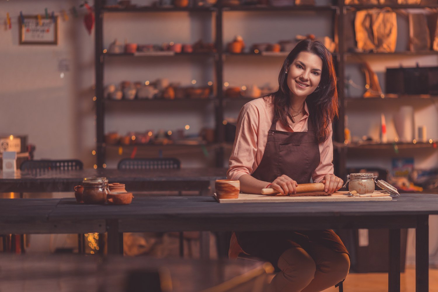 Pottery studio Peak’s Suburban Addition shelves with finished ceramic works