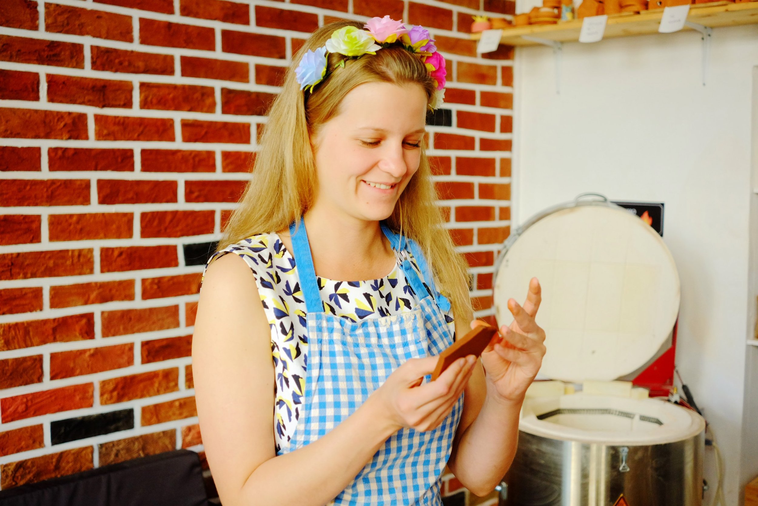 Pottery classes Peak’s Suburban Addition instructor helping students shape clay  