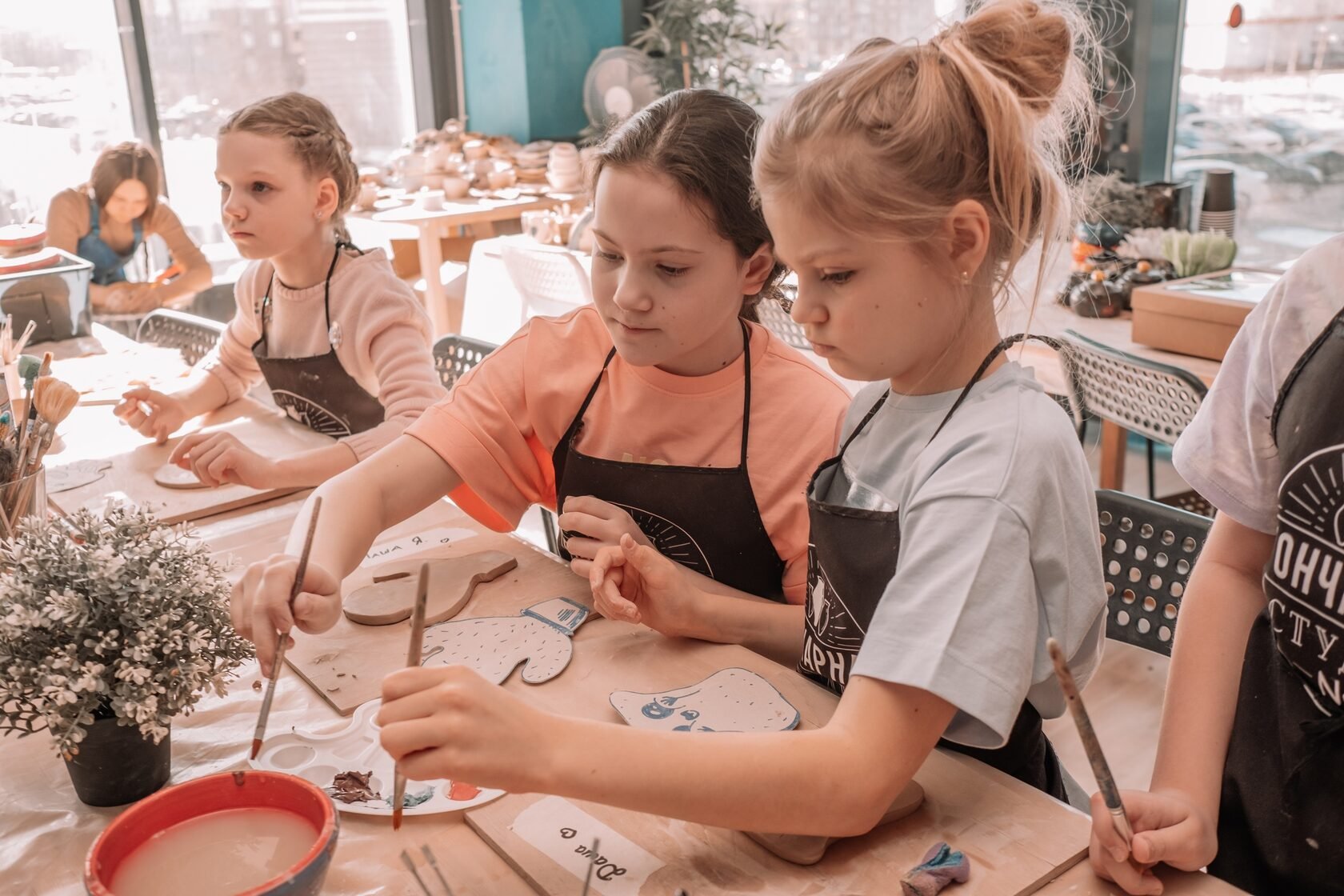 Pottery classes Junius Heights children learning to shape clay   