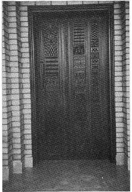 Figure 4. Creative Use of Bedouin Weaving Motifs on Carved Teak Wood Door