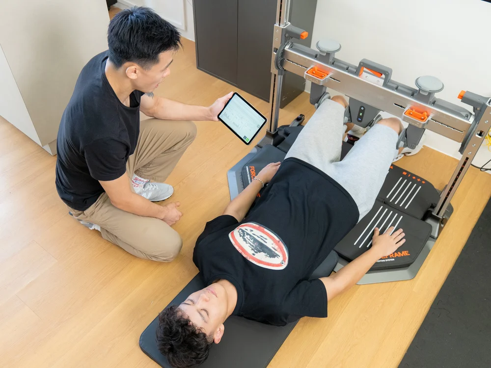 An ARKO clinician guiding a patient through a strength assessment