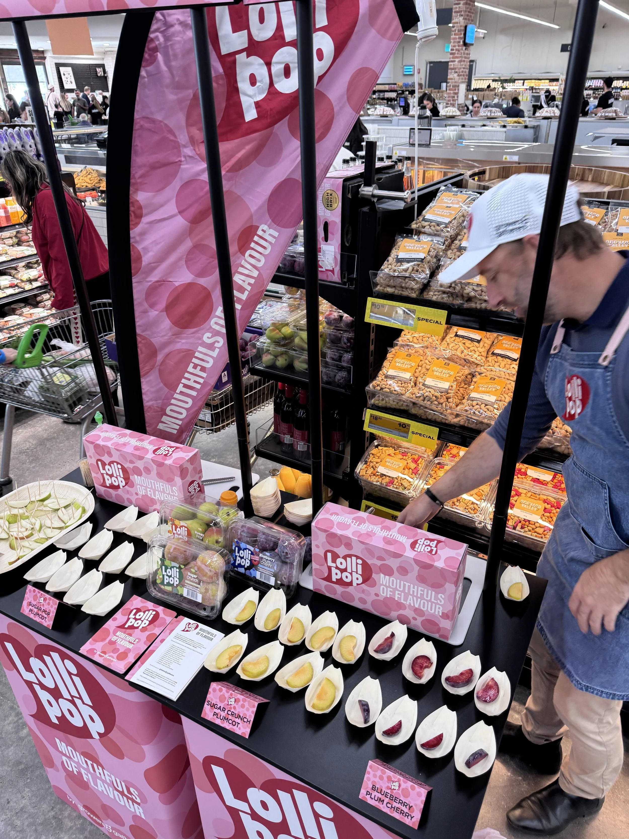 Retail fruit display showcasing strong branding and product visibility