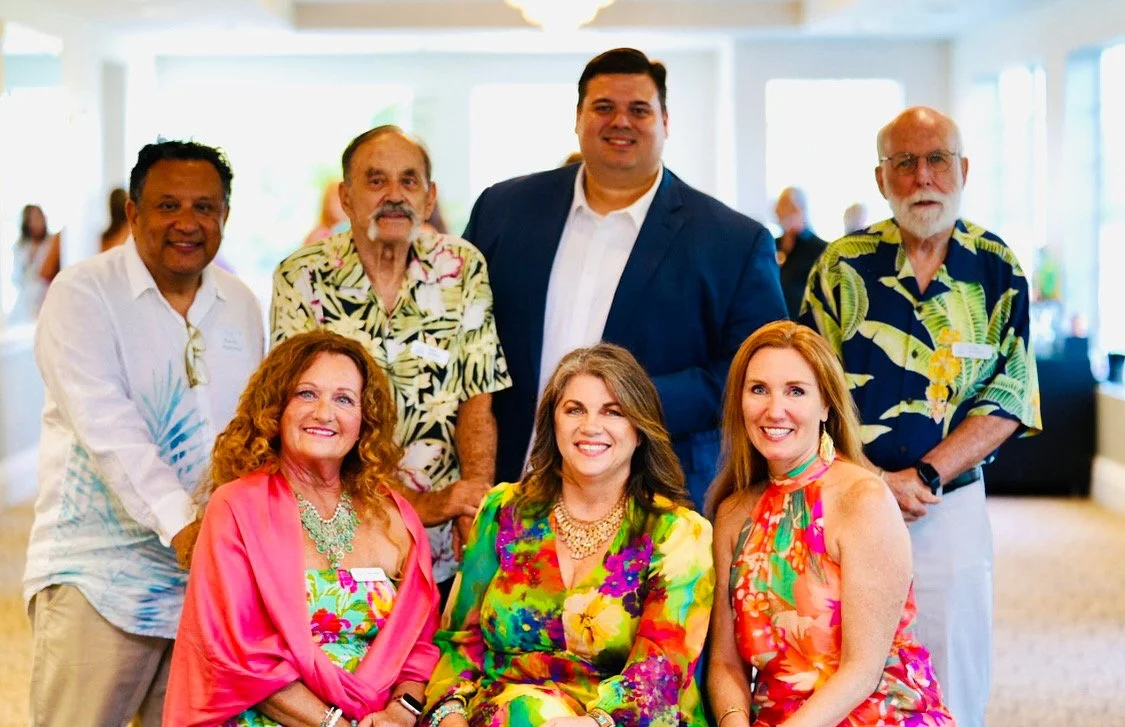 The MWC Board of Directors, with three women sitting and four men standing behind them