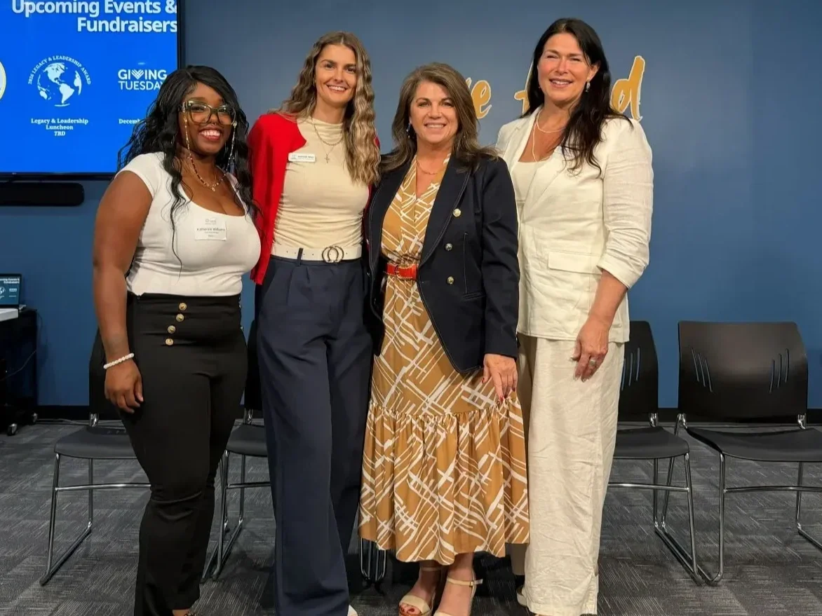 Modern Widows Club HQ leadership team standing together and smiling
