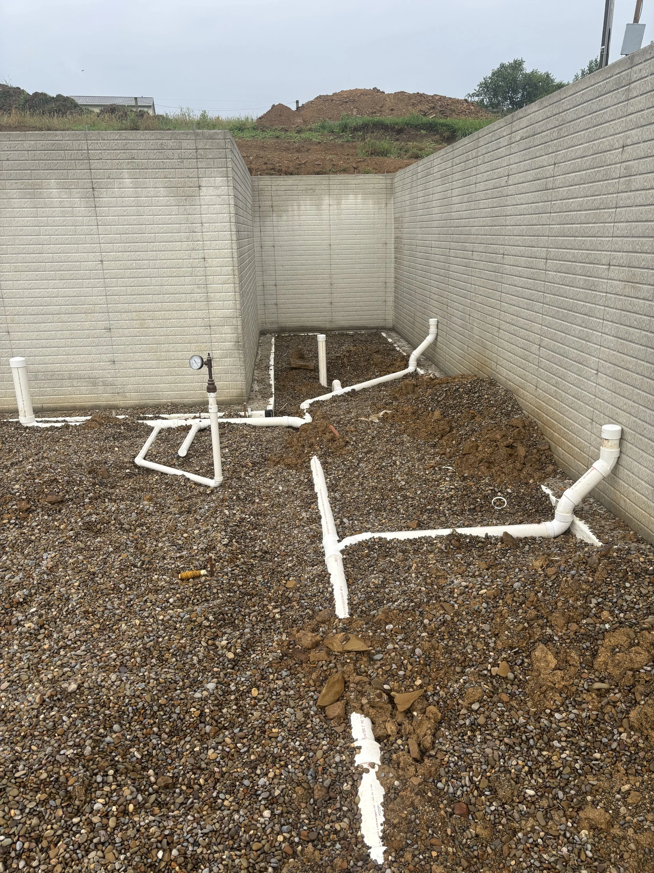 Underground plumbing installation for commercial building construction