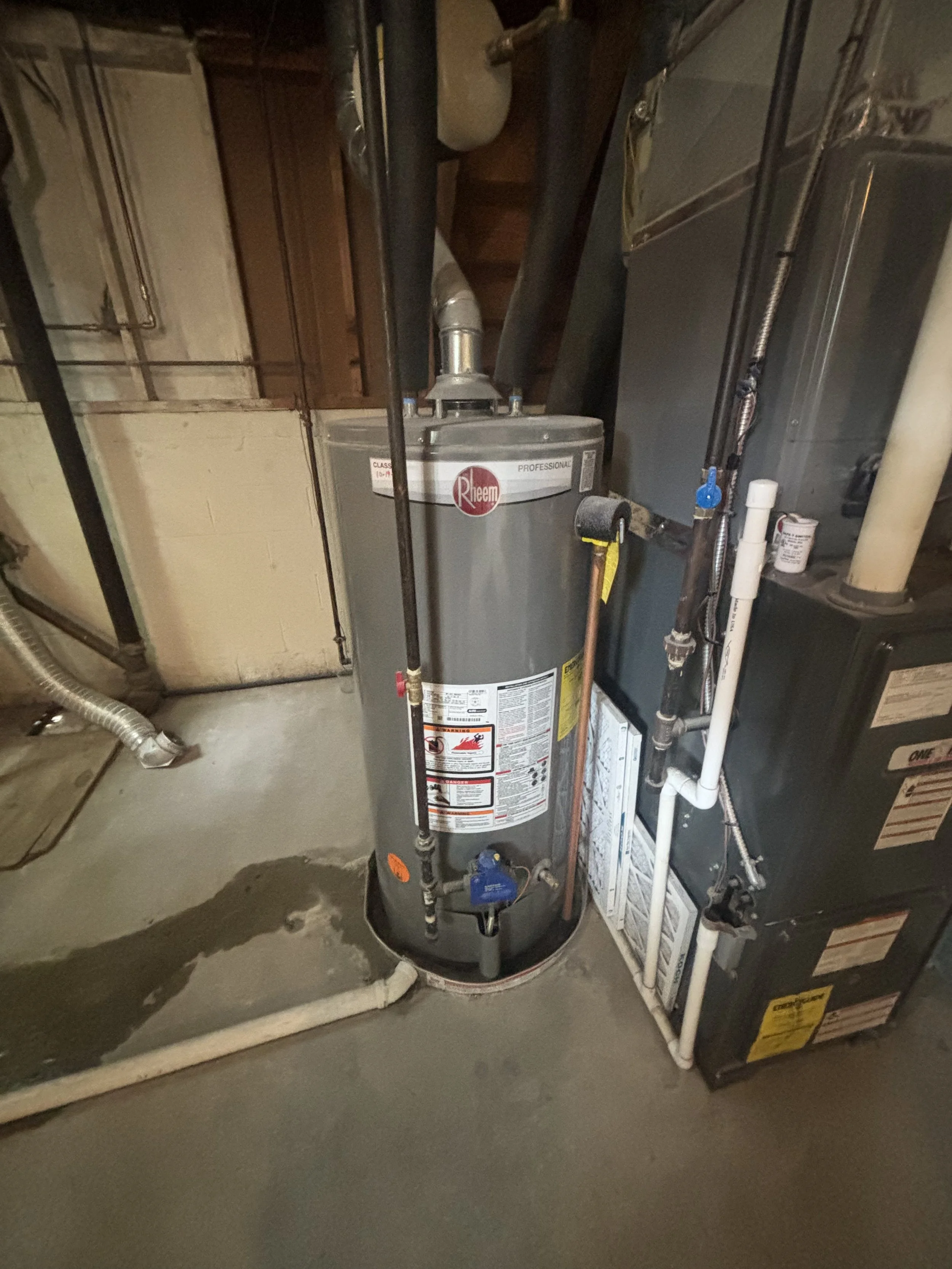Leaking water heater near the end of its service life inspected by RonJon Plumbing prior to replacement in Central Ohio.