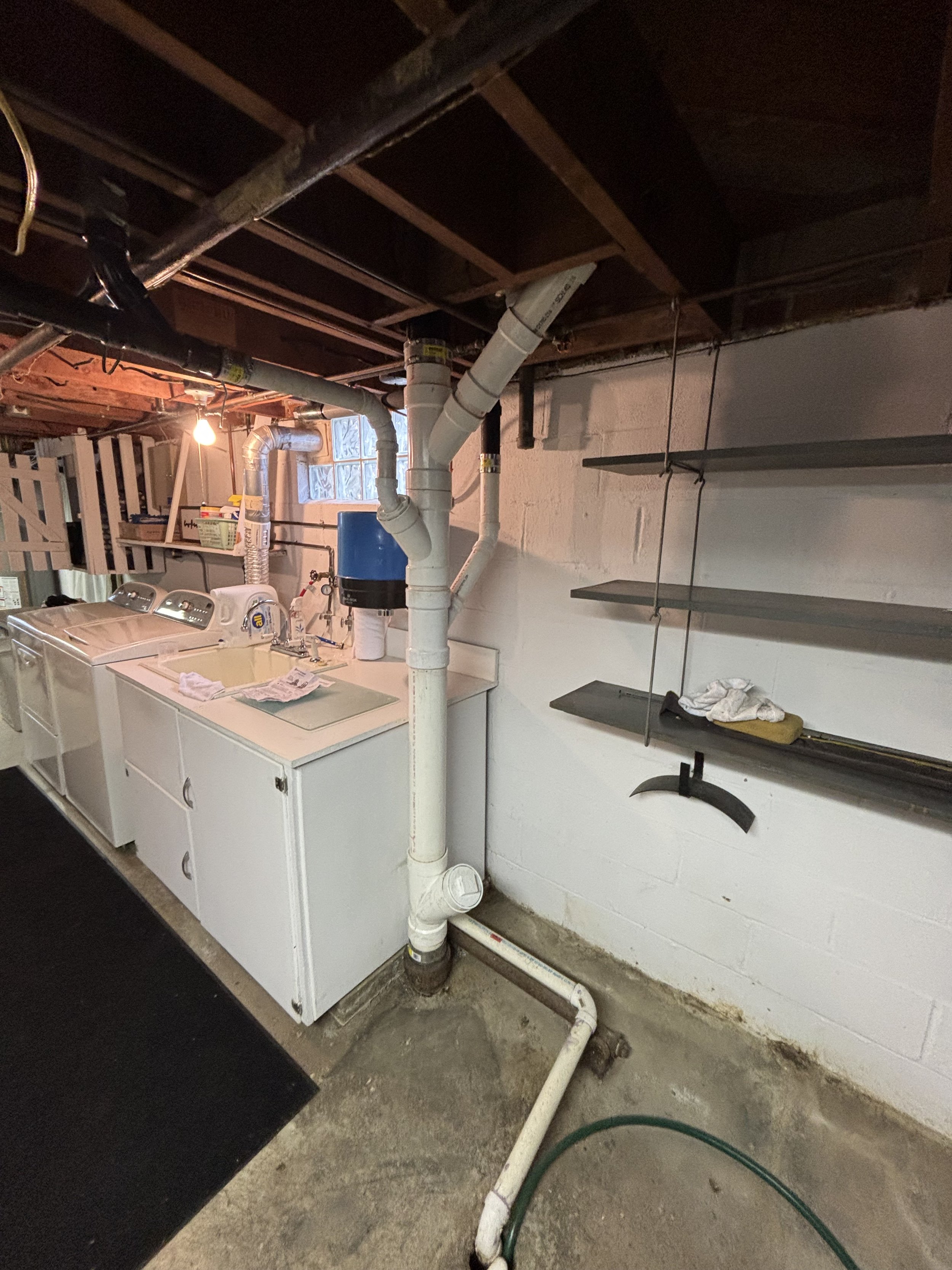 Basement main stack repipe by RonJon Plumbing in Lewis Center, Ohio, featuring new PVC drain branches and a clean-out installation for improved access and flow.