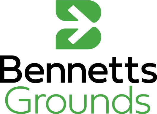 The image shows a green and black abstract logo above the words 'Grounds' written in green.