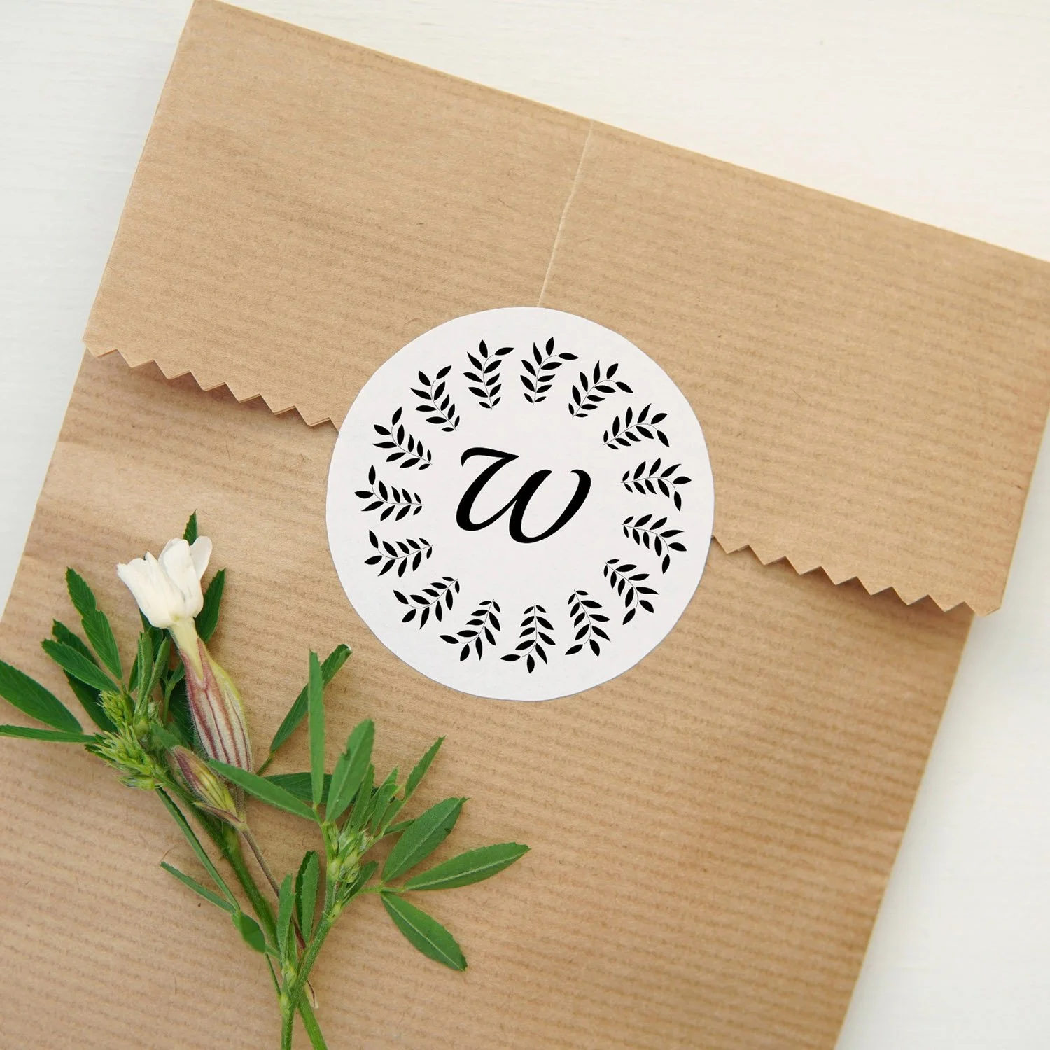 Black laurel leaf round sticker paper bag mu.jpeg