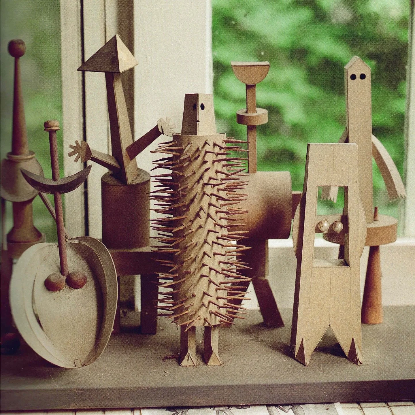 Irving Harper. Paperboard, toothpicks, clock parts, plastic eyes, wood base.