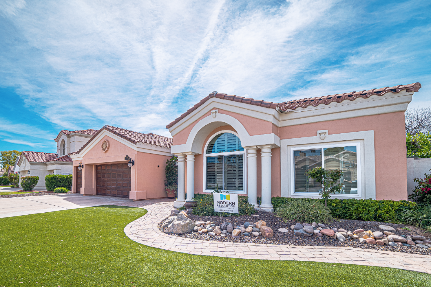 Exterior Home With New Windows And Logo Sign.png