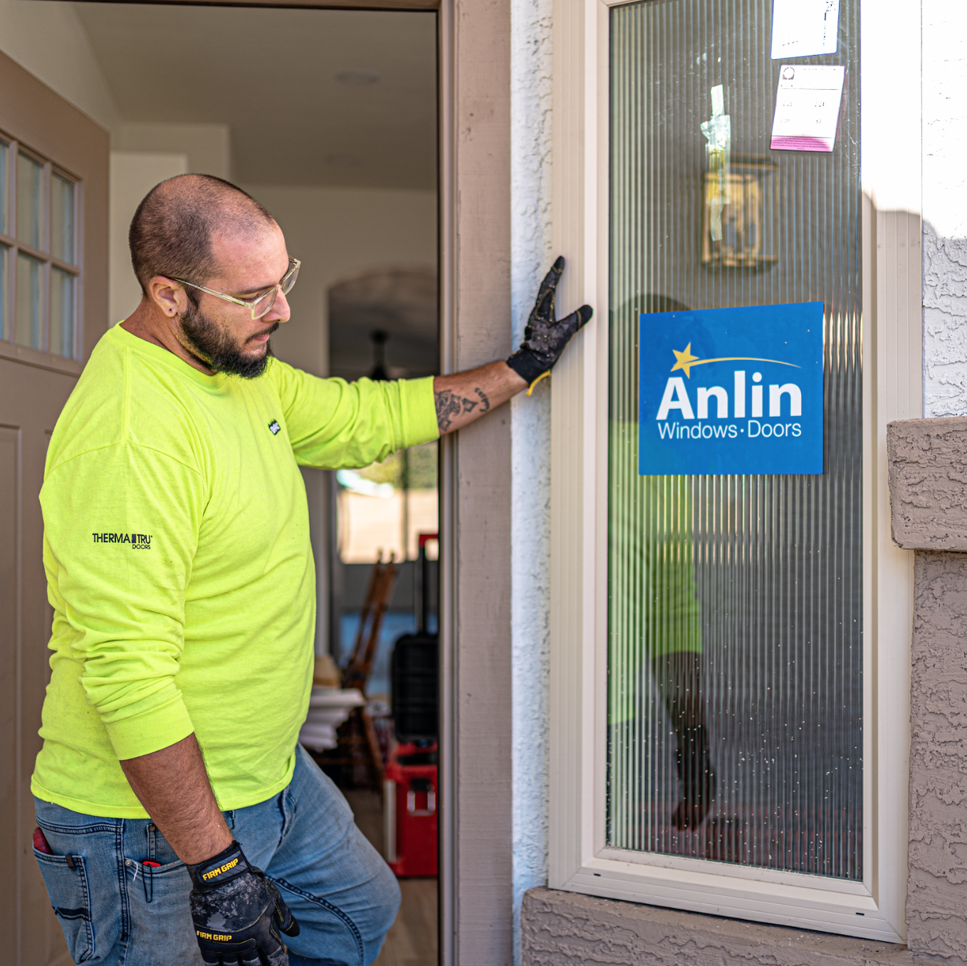 Modern Resolution Windows & Doors installer completing a replacement window installation in Phoenix, Arizona.