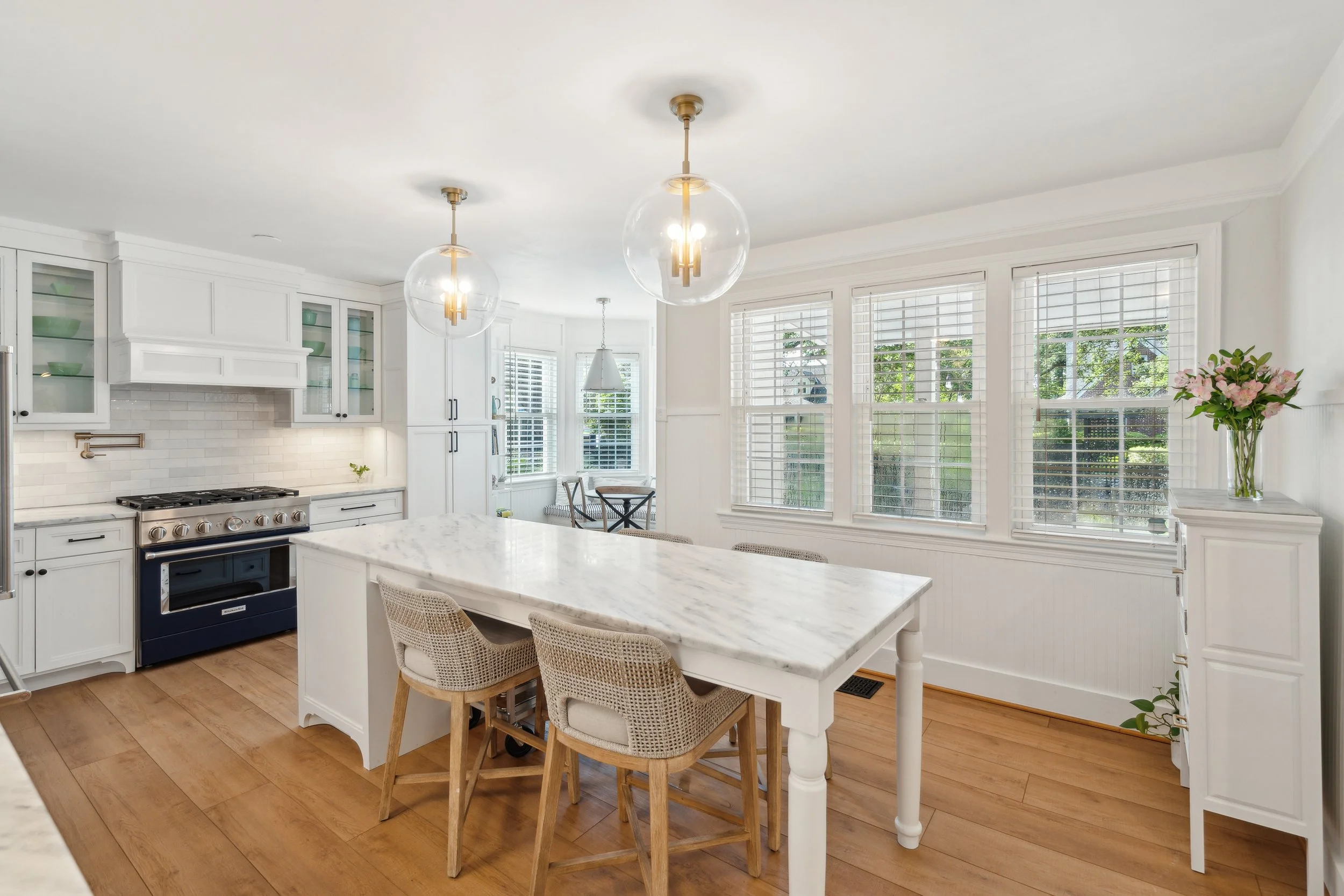 Bright open chef's kitchen in a Charleston home featuring natural light, spacious design, and thoughtful details