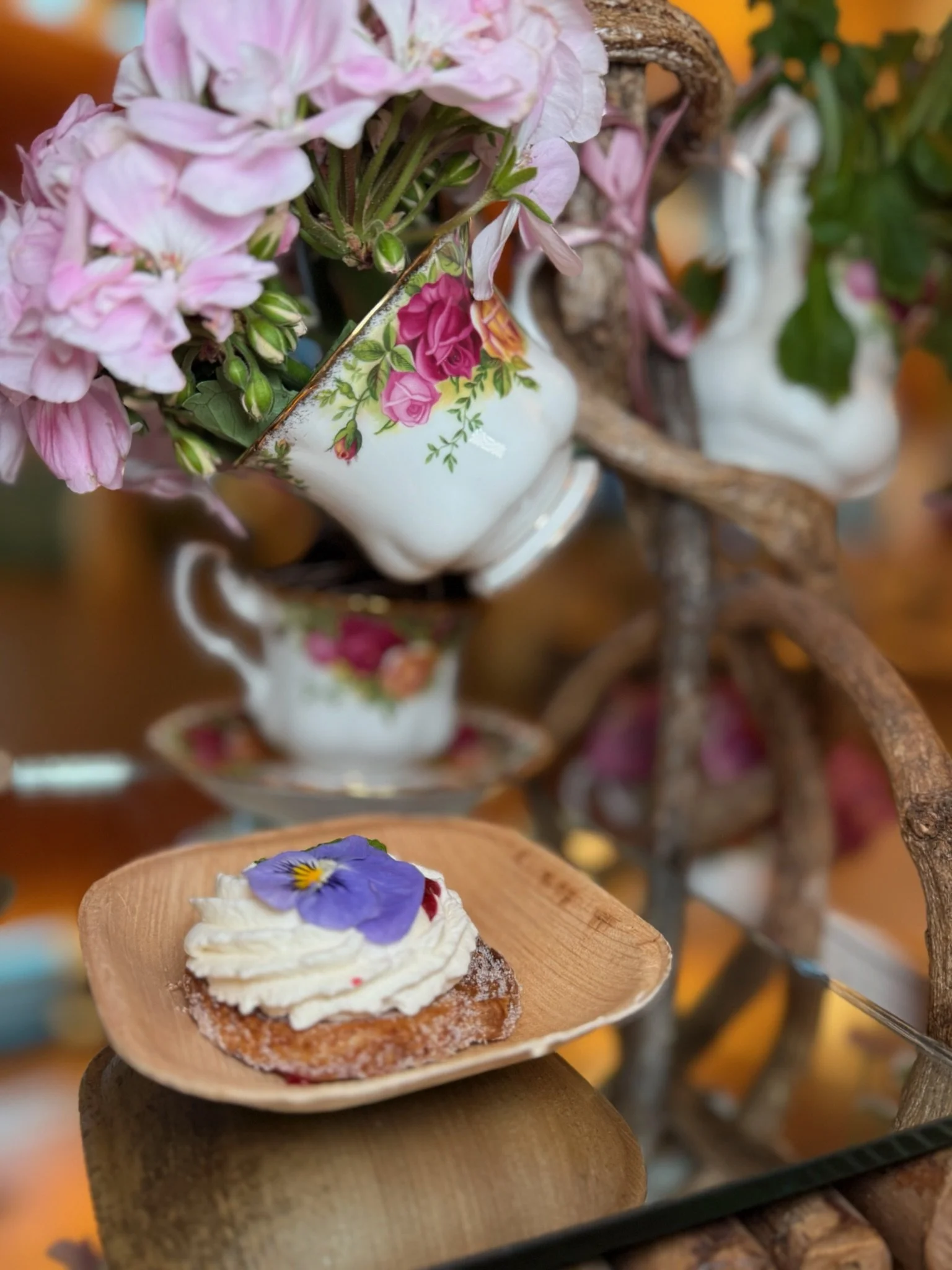 Cupcakes topped with edible flower blooms at a local Charleston event, showcasing creative Lowcountry baking and floral artistry.