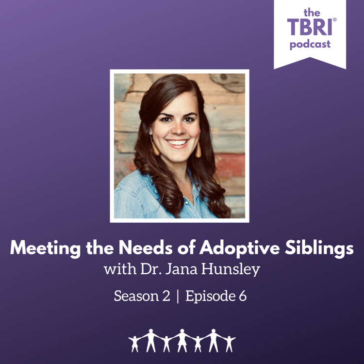 image of jana - a woman with dark brown curly hair in front of a wood wall