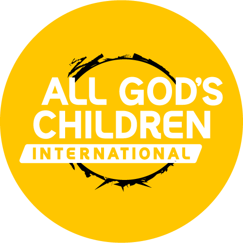 yellow circle with words All God's Children International in white