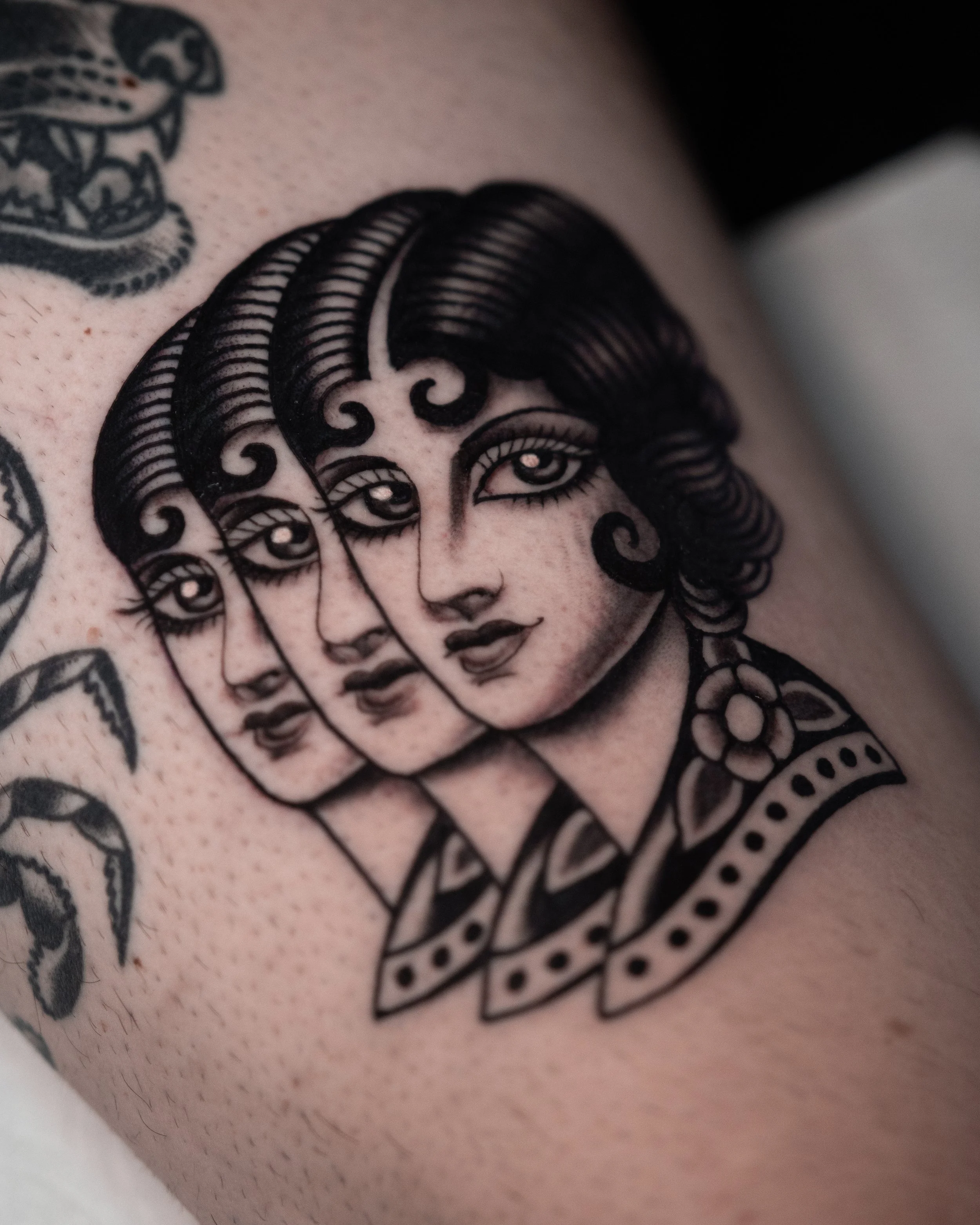 Tattoo of a woman's face with three overlapping images, styled with vintage hair and clothing, in black ink. Done at San Luis Tattoo Company by Danny Derrick in San Luis Obispo, CA SLO.