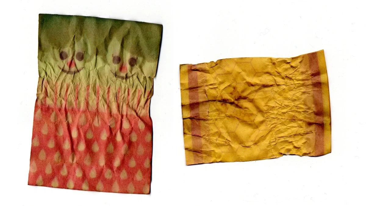   A scanned image of the strawberry and honey drop wrappers laid out flat.  