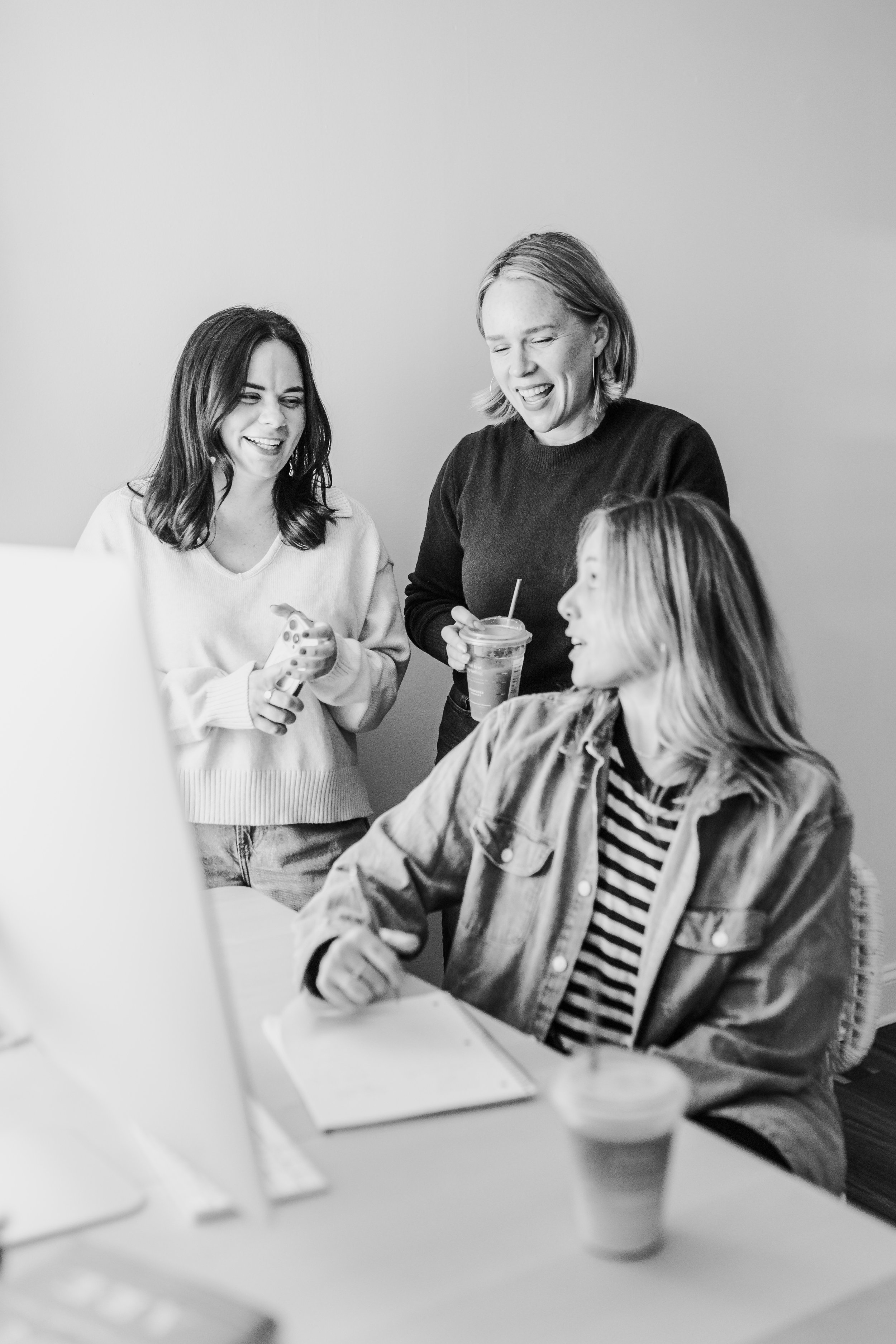 Three women laughing
