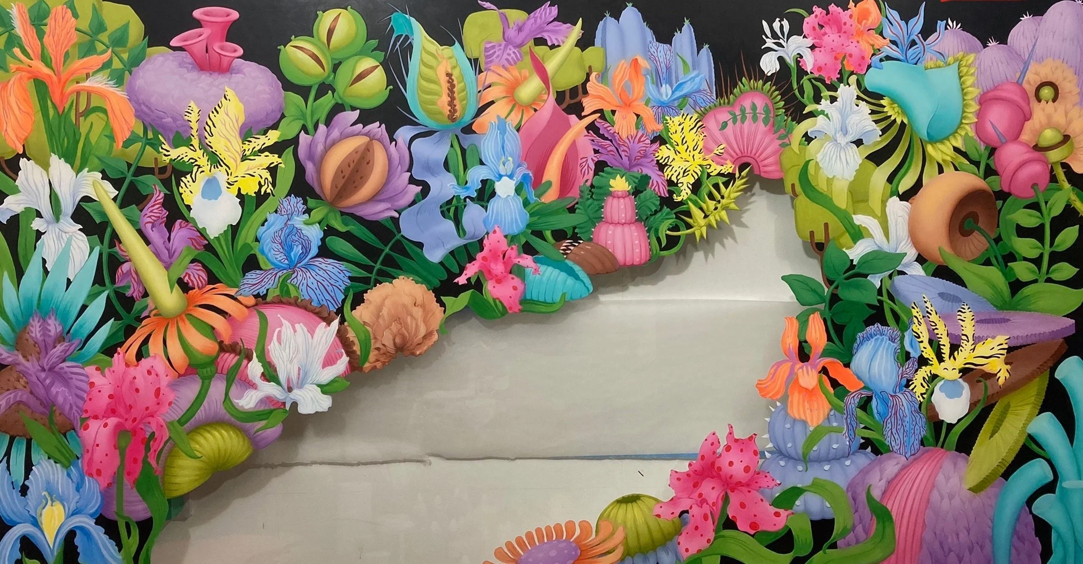 Colorful, artistic floral collage with various flowers, plants, and abstract shapes on a black background.