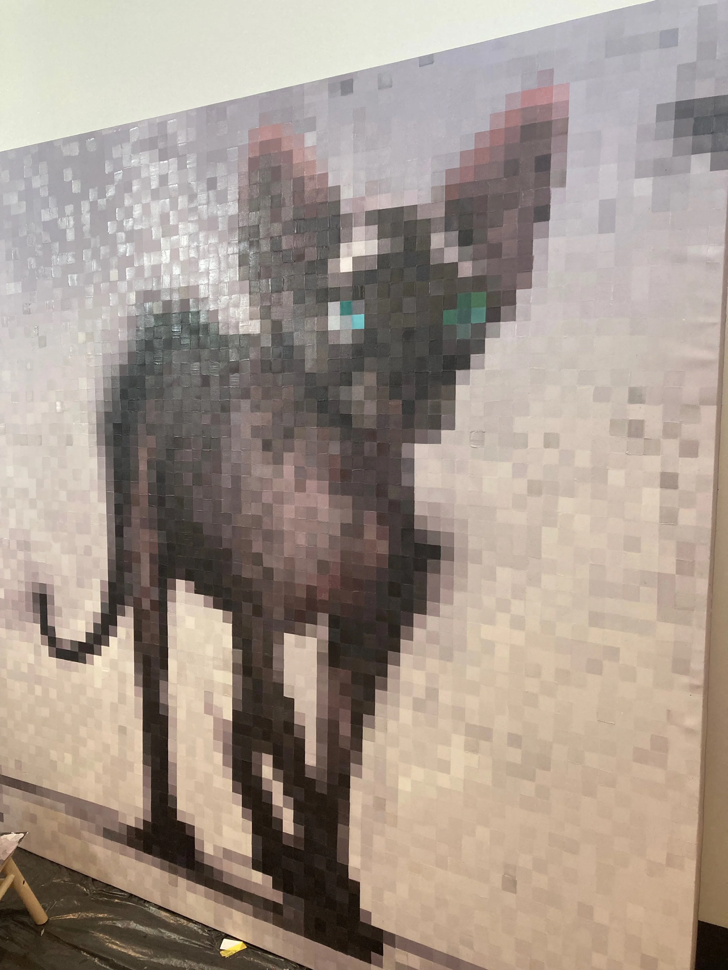 Pixelated portrait of a dog with pointy ears and teal-colored eyes