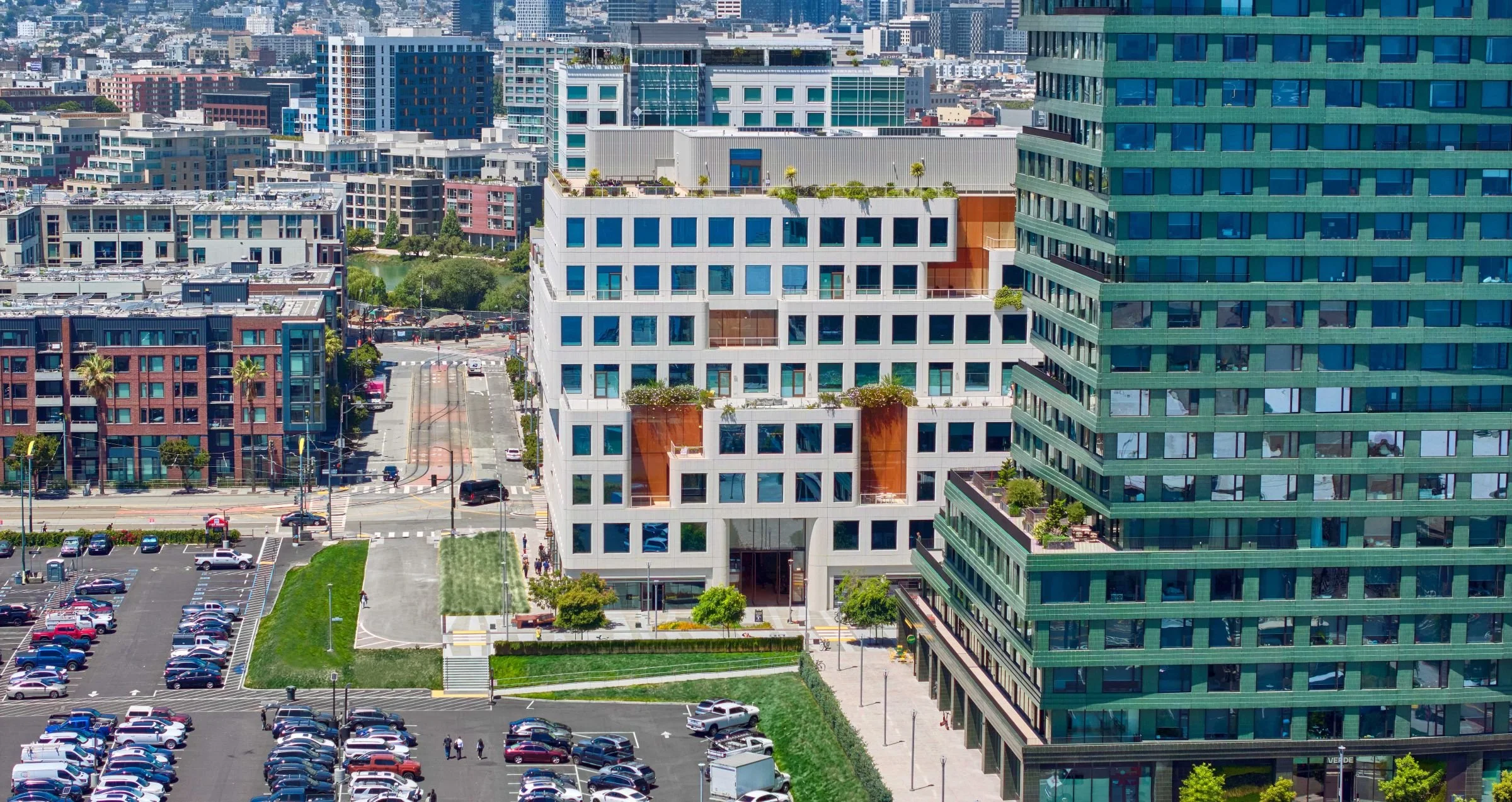 Elevated view of Mission Rock Block B with stepped terraces, landscaped setbacks, and surrounding neighborhood