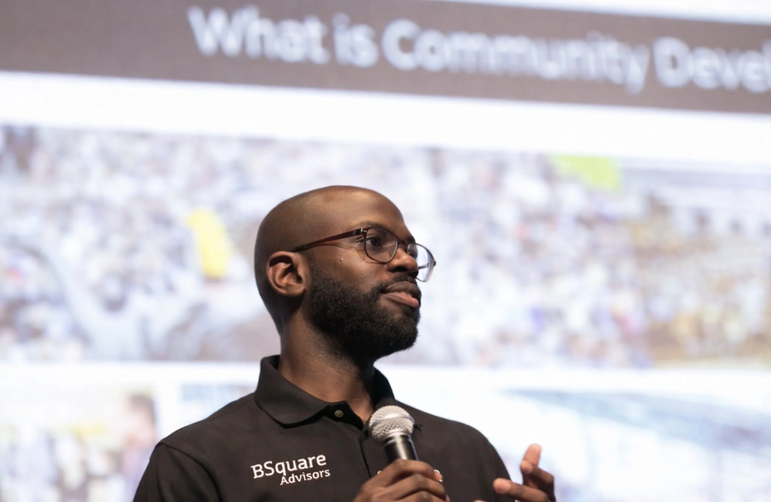 BSquare-Advisors-Yannick-Brookes-Speaking-Engagement-With-Mic-in-hand