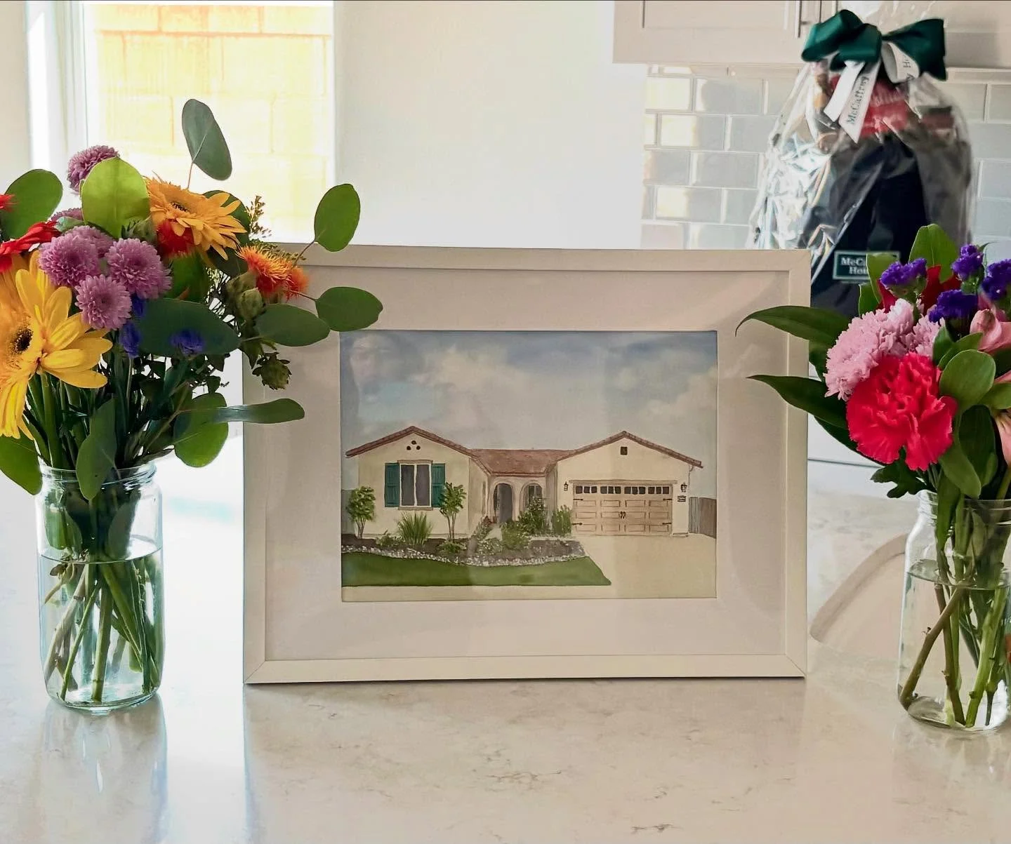 My parents are moving to be closer to us so naturally when we got the keys first we had to go spam them with TJs bouquets and sidewalk chalk welcome graffiti and a painting of their old house. So excited they will now be close enough for family dinne
