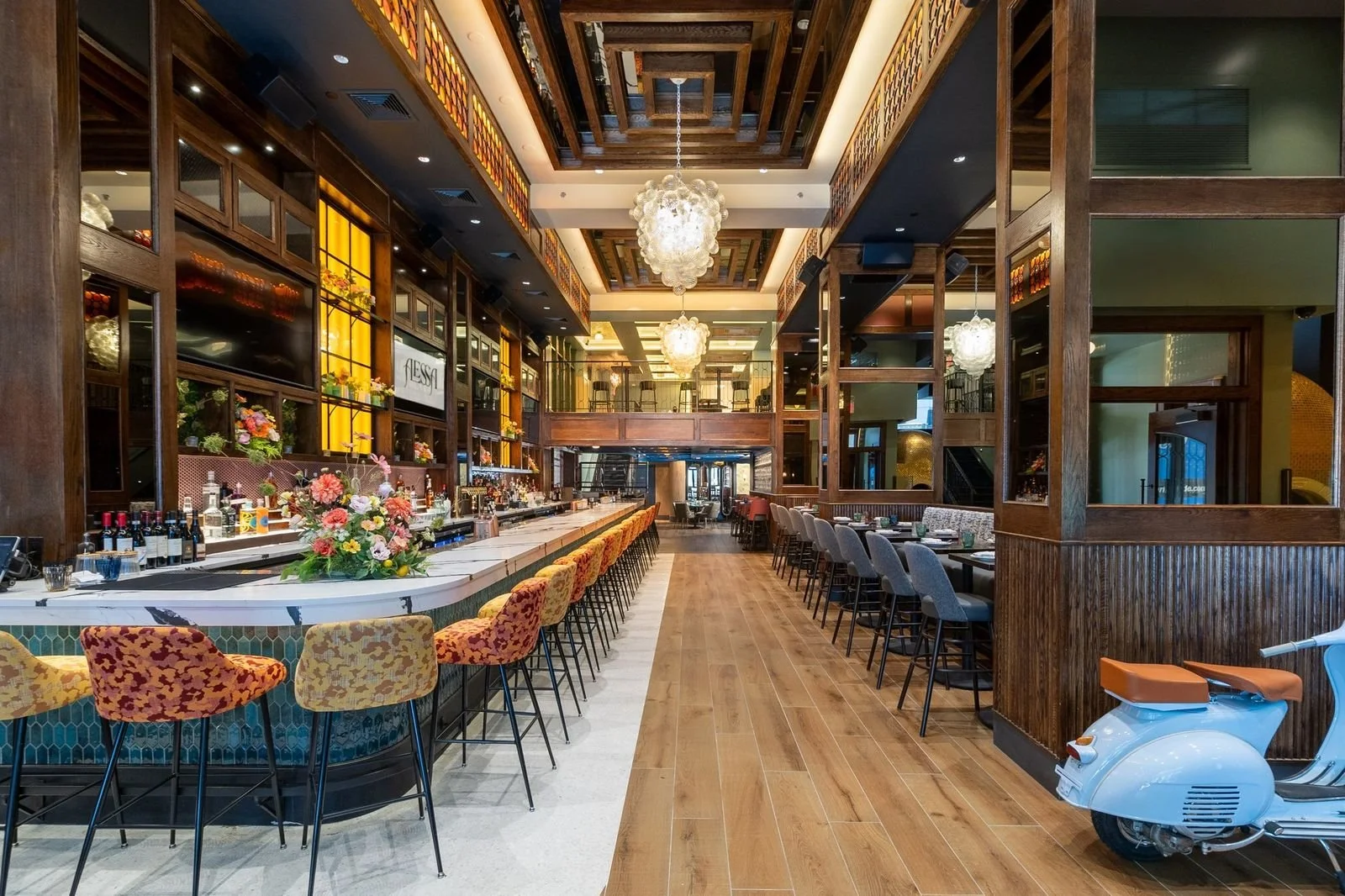 A long marble bar with flowers and bottles
