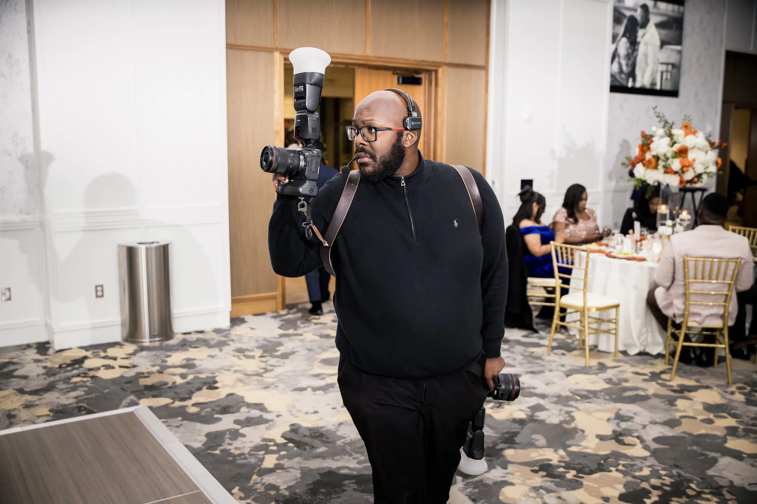BTP photographer documenting a formal event