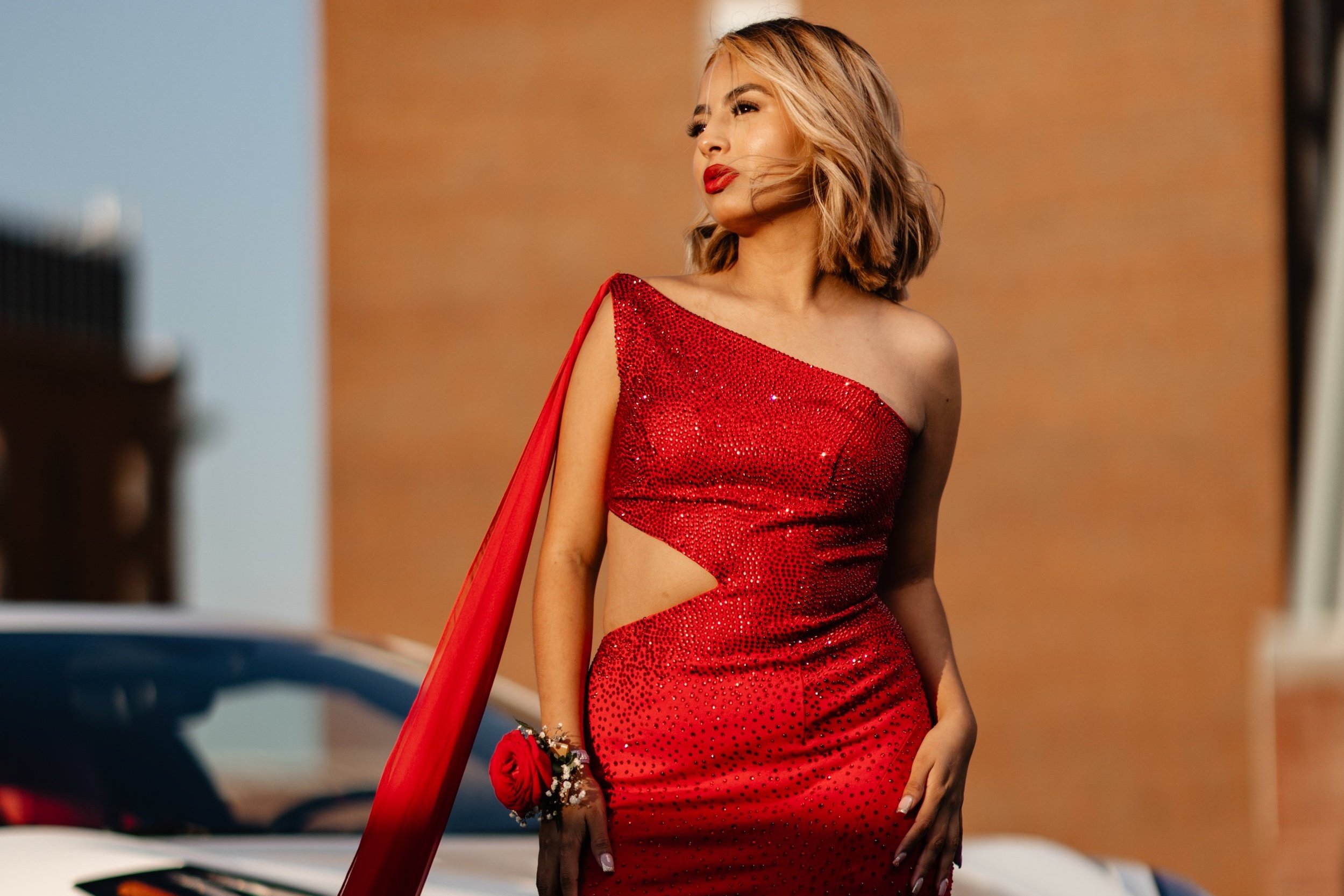 Senior portrait in a red sequined dress