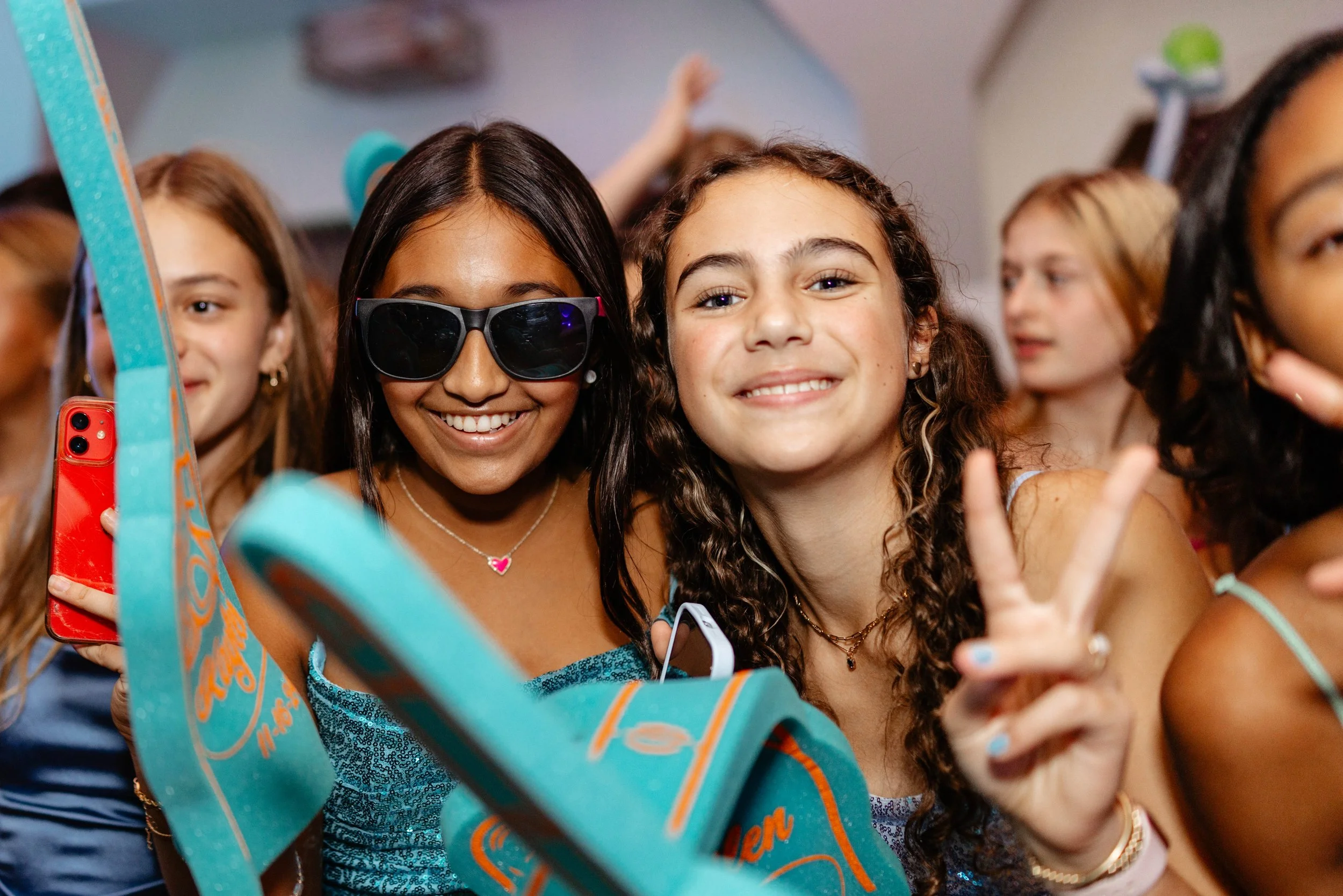 Friends taking a joyful selfie at a celebration
