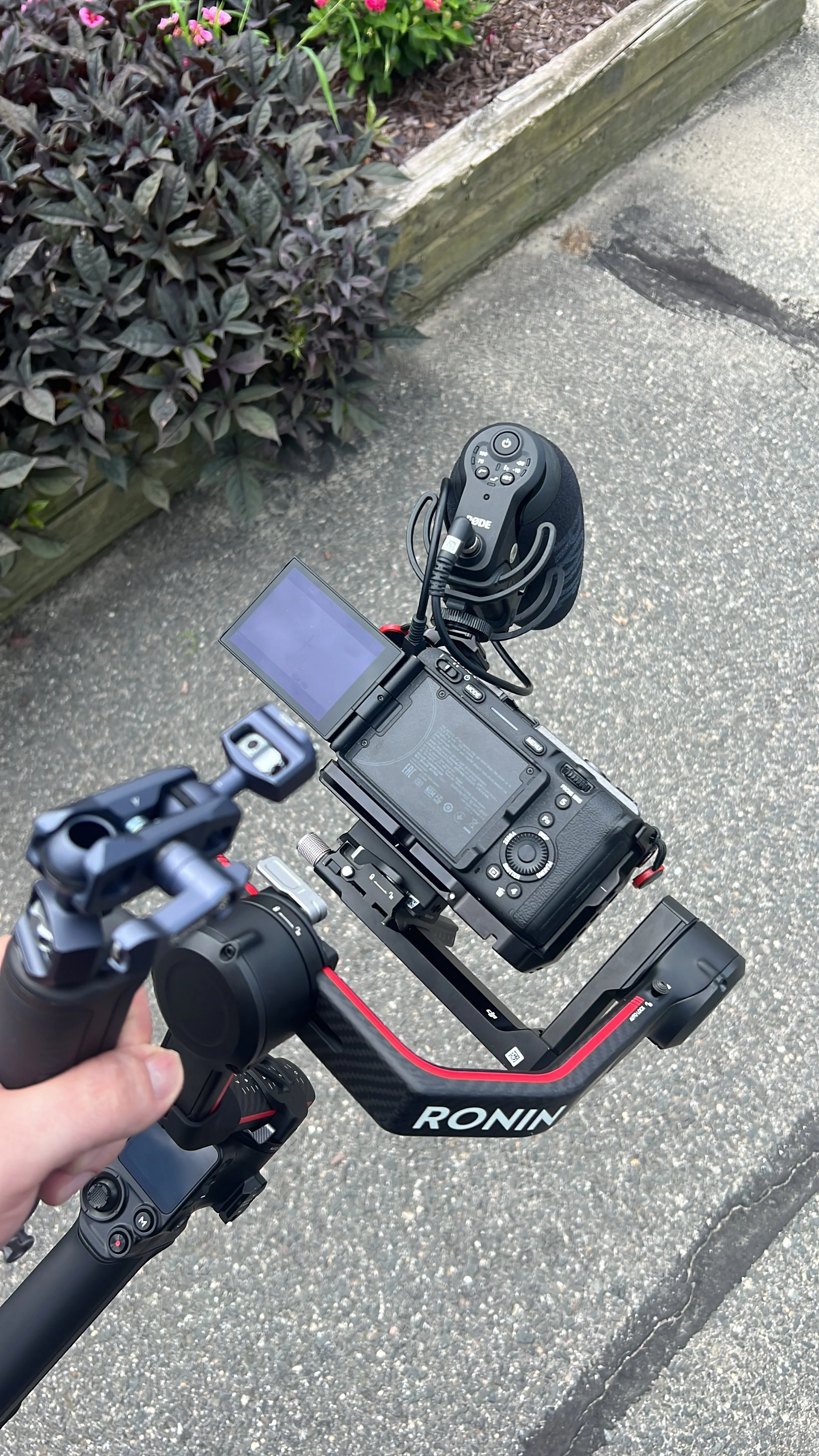 A phone photo of Nico with a nimble FX30 atop a gimbal