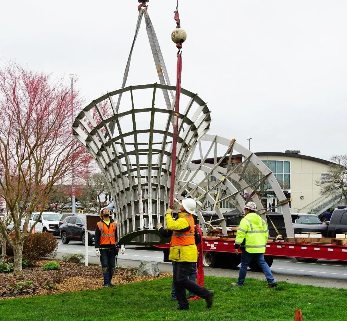  installation crew uses a crane to place the sections of Gateway Canopy into place.