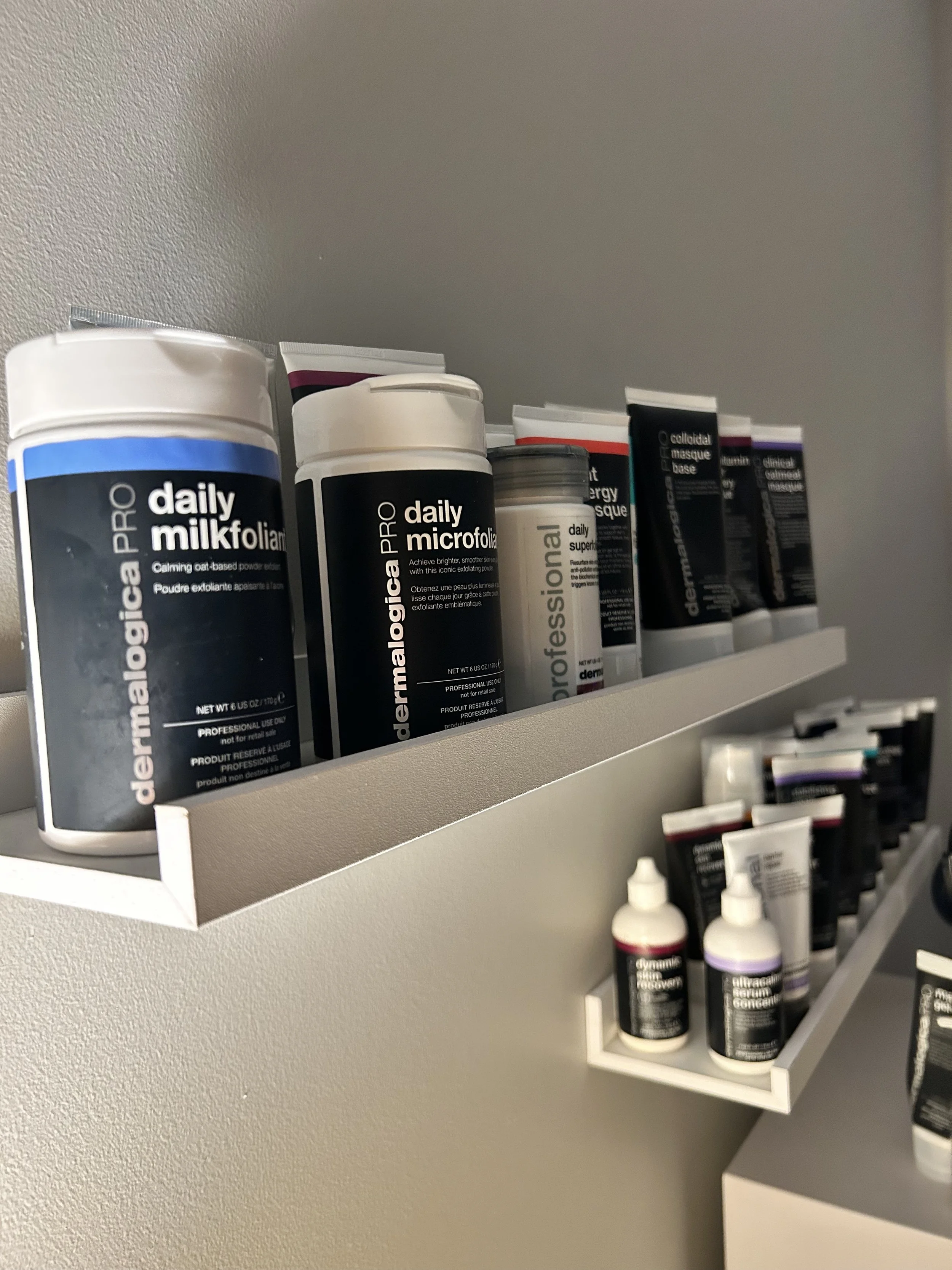 dermalogica facial producs on a shelf in a treatment room