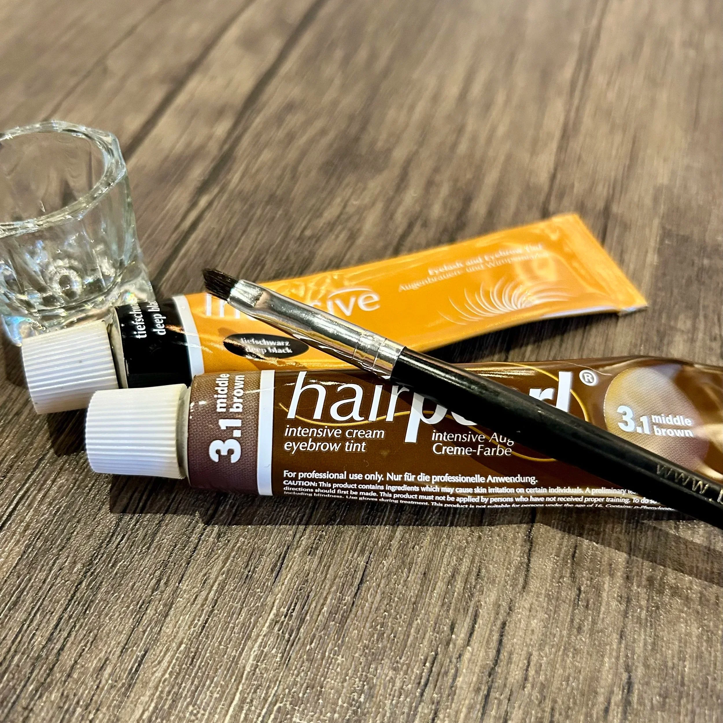 eyebrow and lash tinting supplies with brush and glass jar