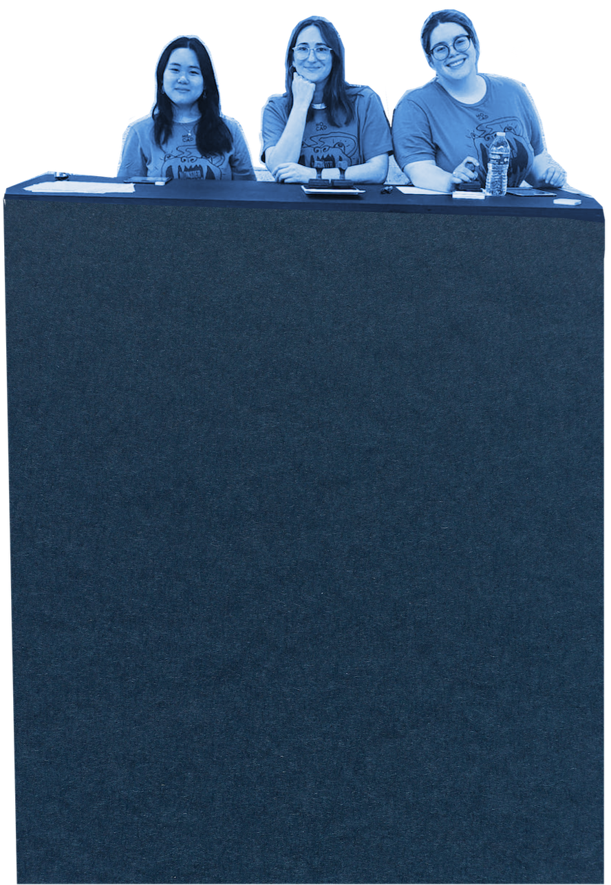 three women at a desk