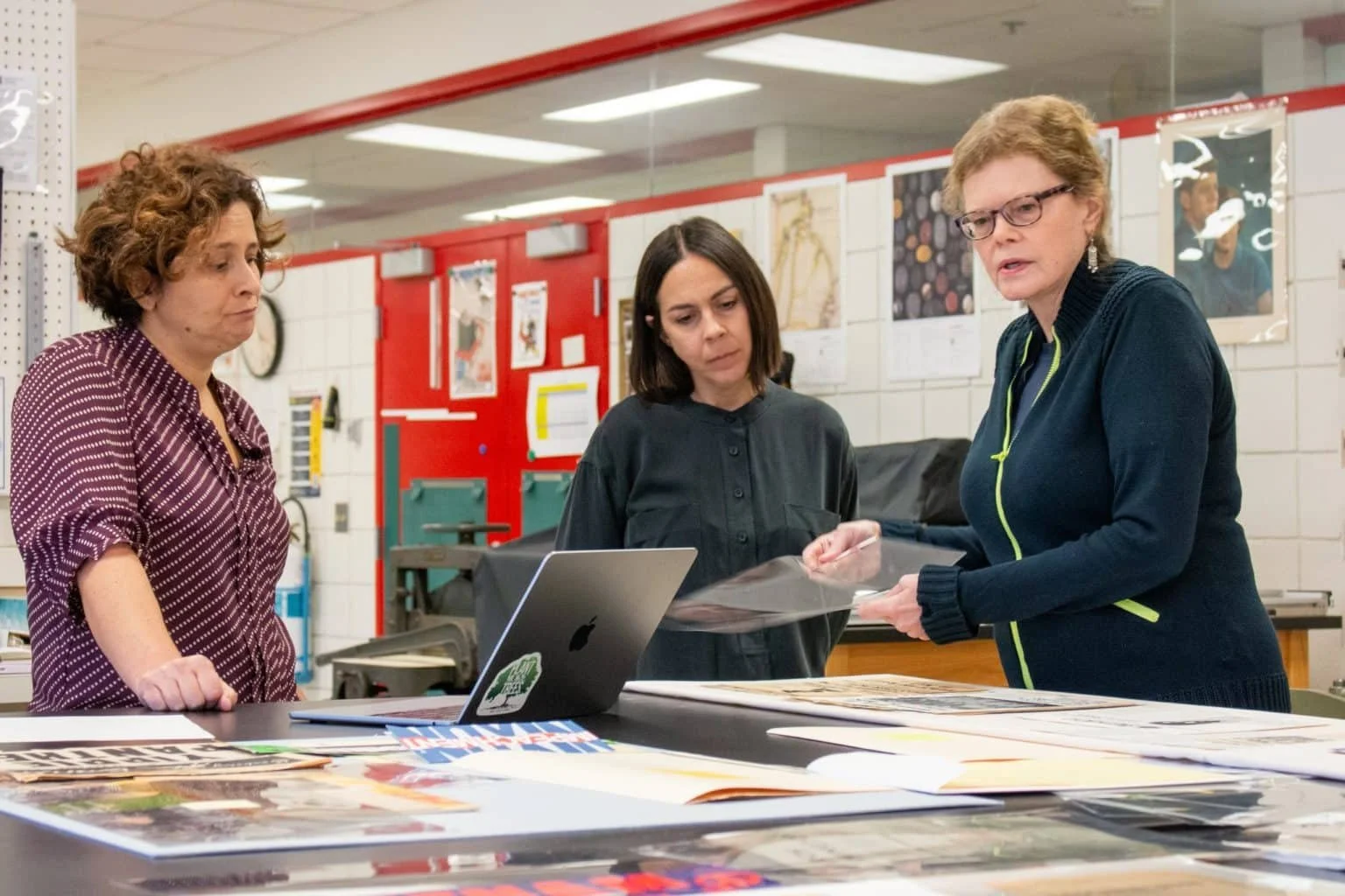 “American Sampler” exhibit curator Julie Ault reviews archival materials from the University of Michigan’s Joseph A. Labadie Collection. Courtesy of the University of Michigan Museum of Art
