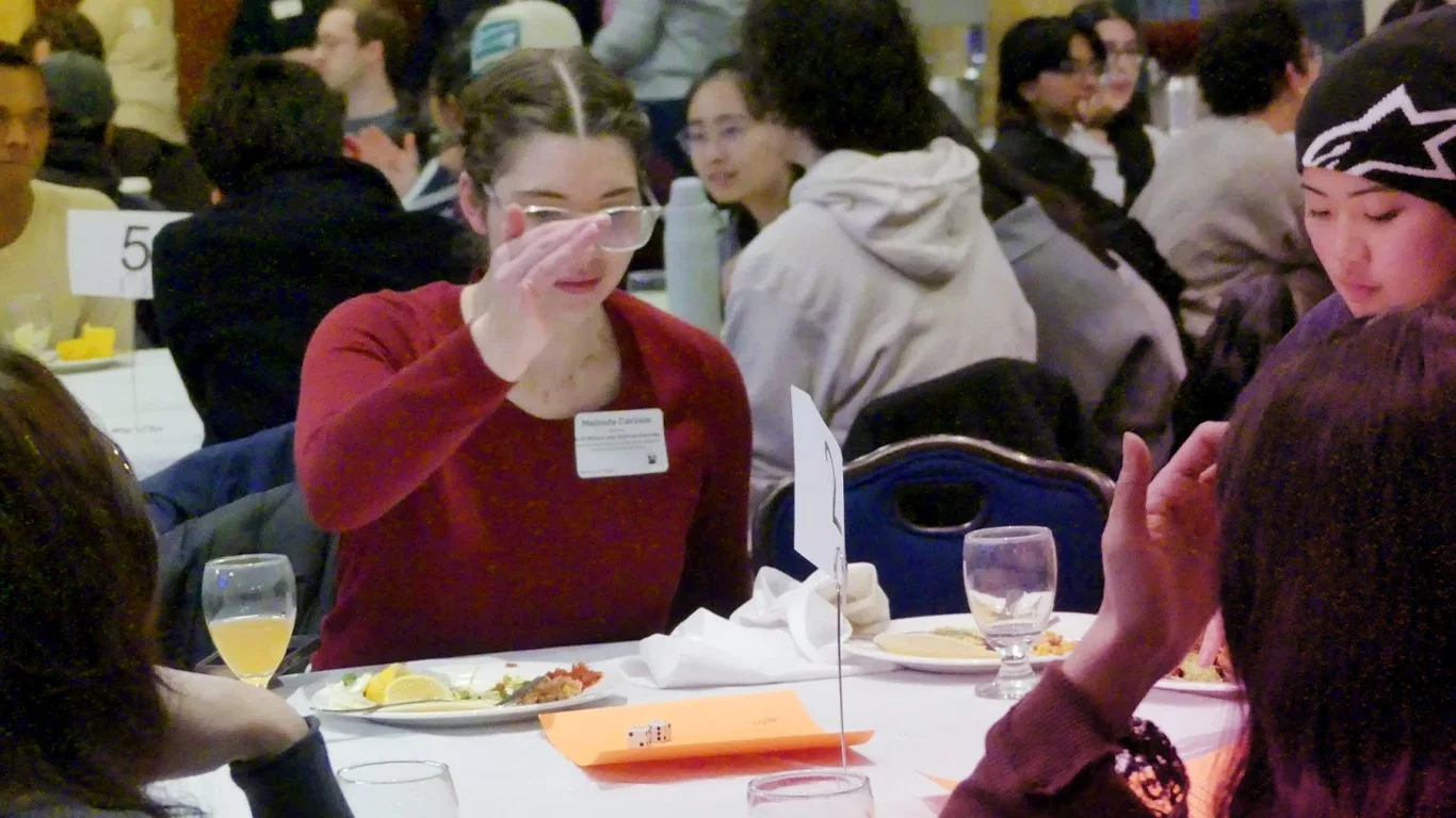 Students rolling dice at the Student Arts Org Summit