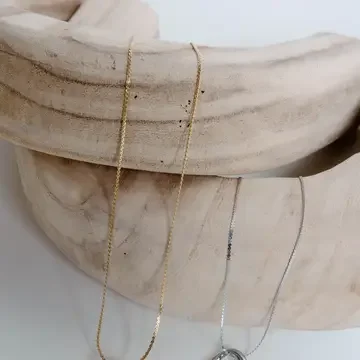 Defying Gravity Necklace (Silver and Gold)