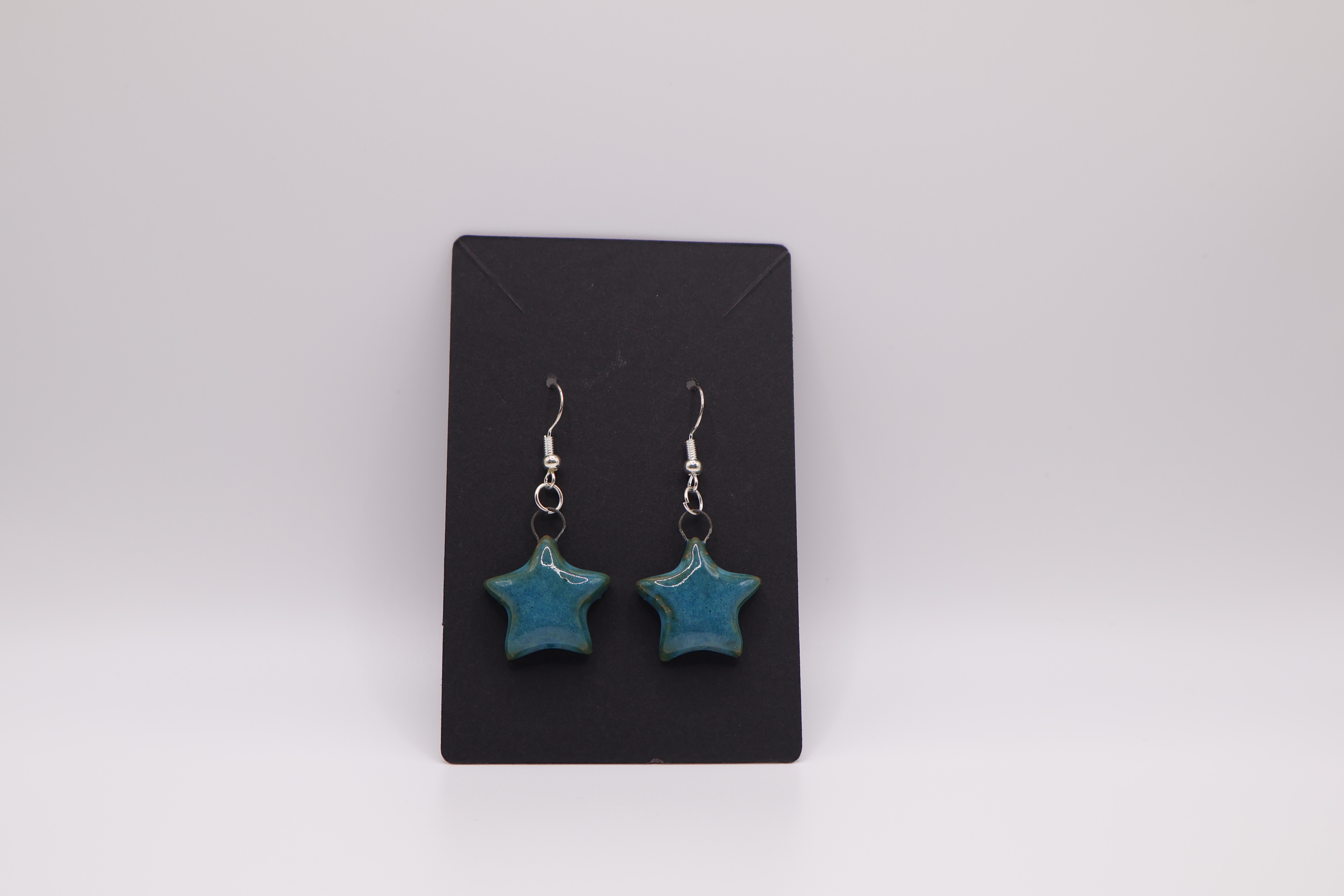 blue earrings star.png