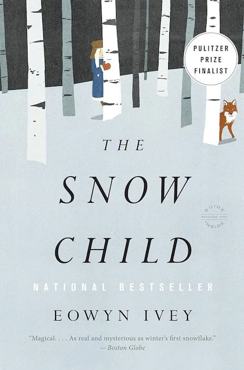 Cover of The Snow Child by Eowyn Ivey. Blue-grey snow background with illustration of young girl with blond hair peeking out behind one of several birch trees, and an orange fox peeking out behind another.